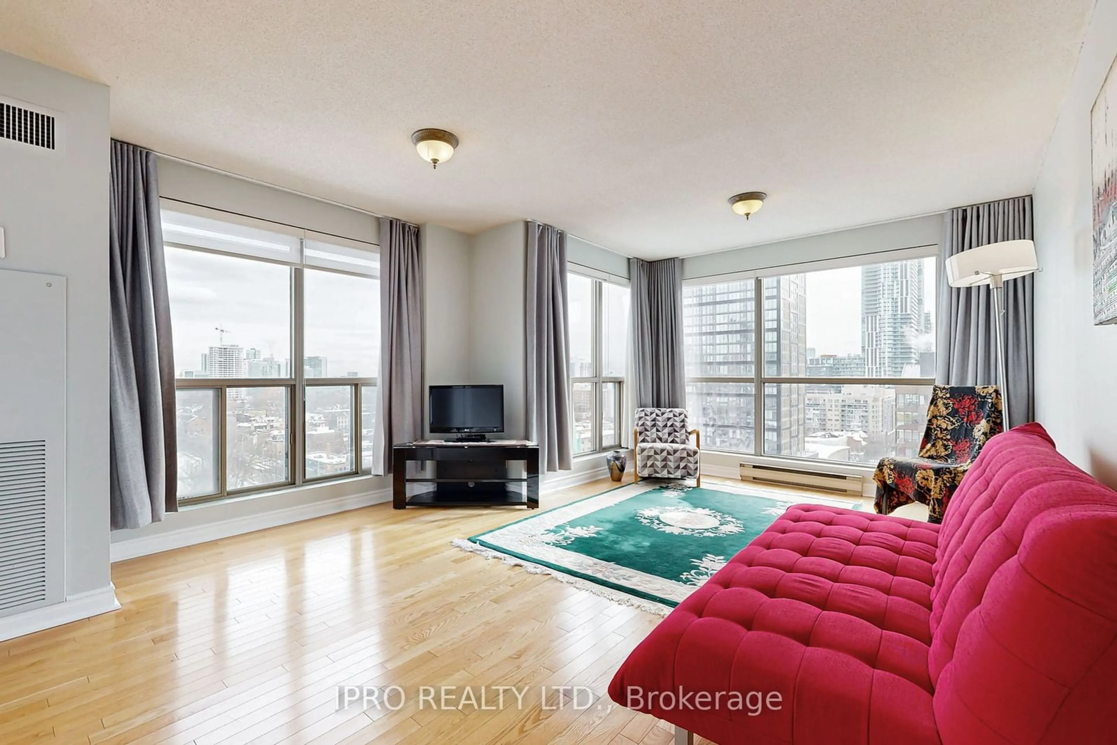 Living room with furniture, wood/laminate floor for 298 Jarvis St #1406, Toronto Ontario M5B 2M4