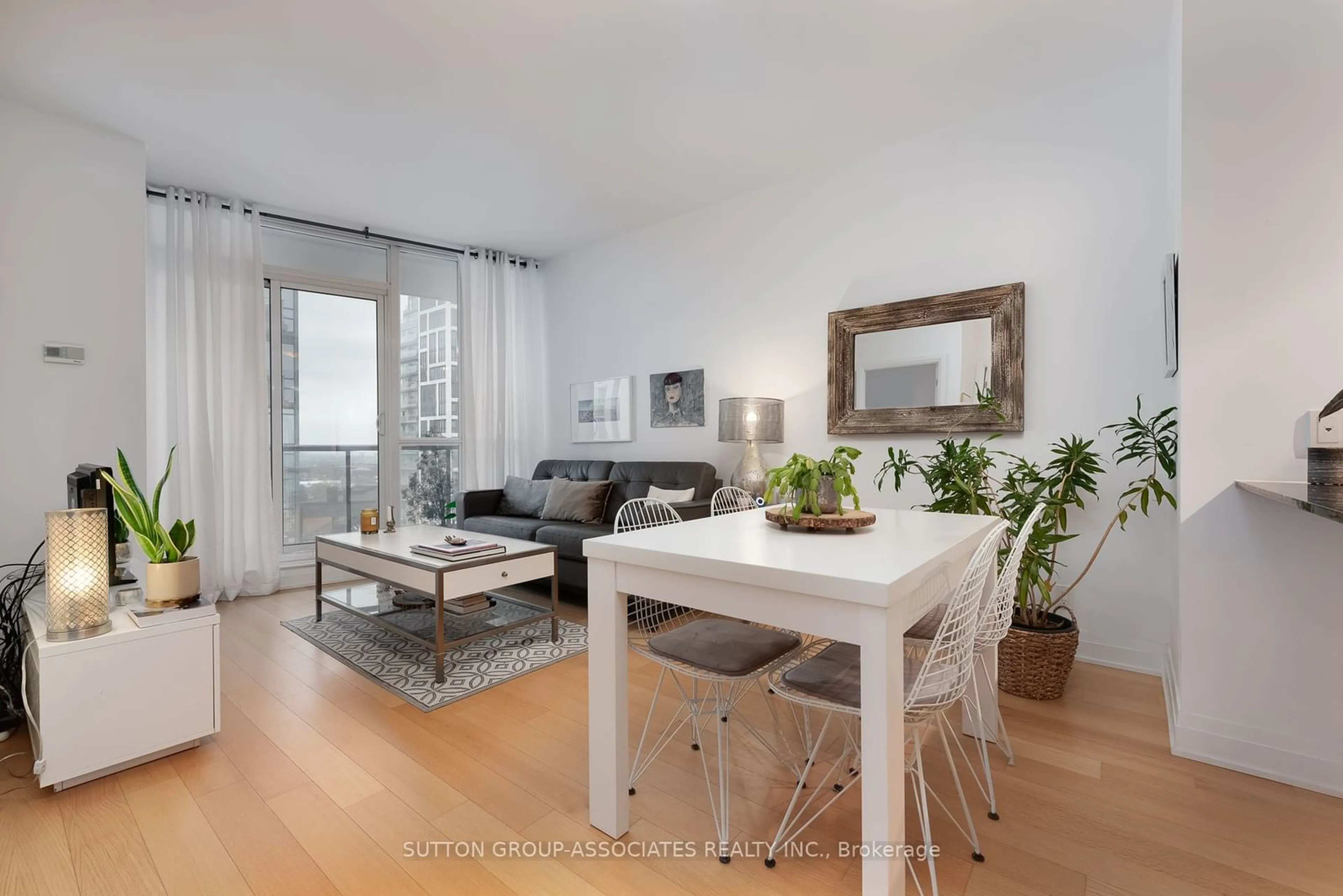 Living room with furniture, wood/laminate floor for 530 St Clair Ave #1406, Toronto Ontario M6C 0A2