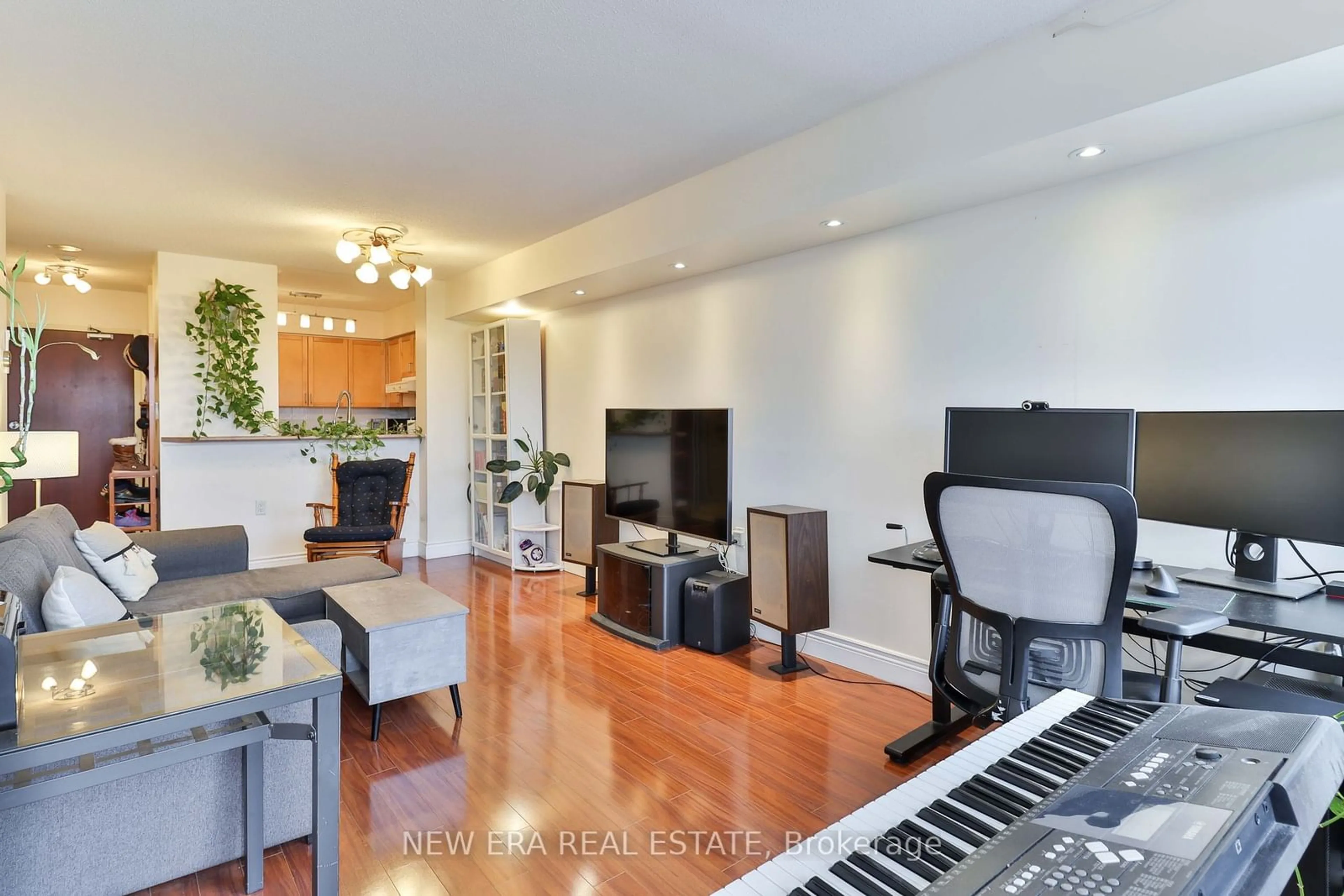 Living room with furniture, wood/laminate floor for 35 Finch Ave #1507, Toronto Ontario M2N 6Z8