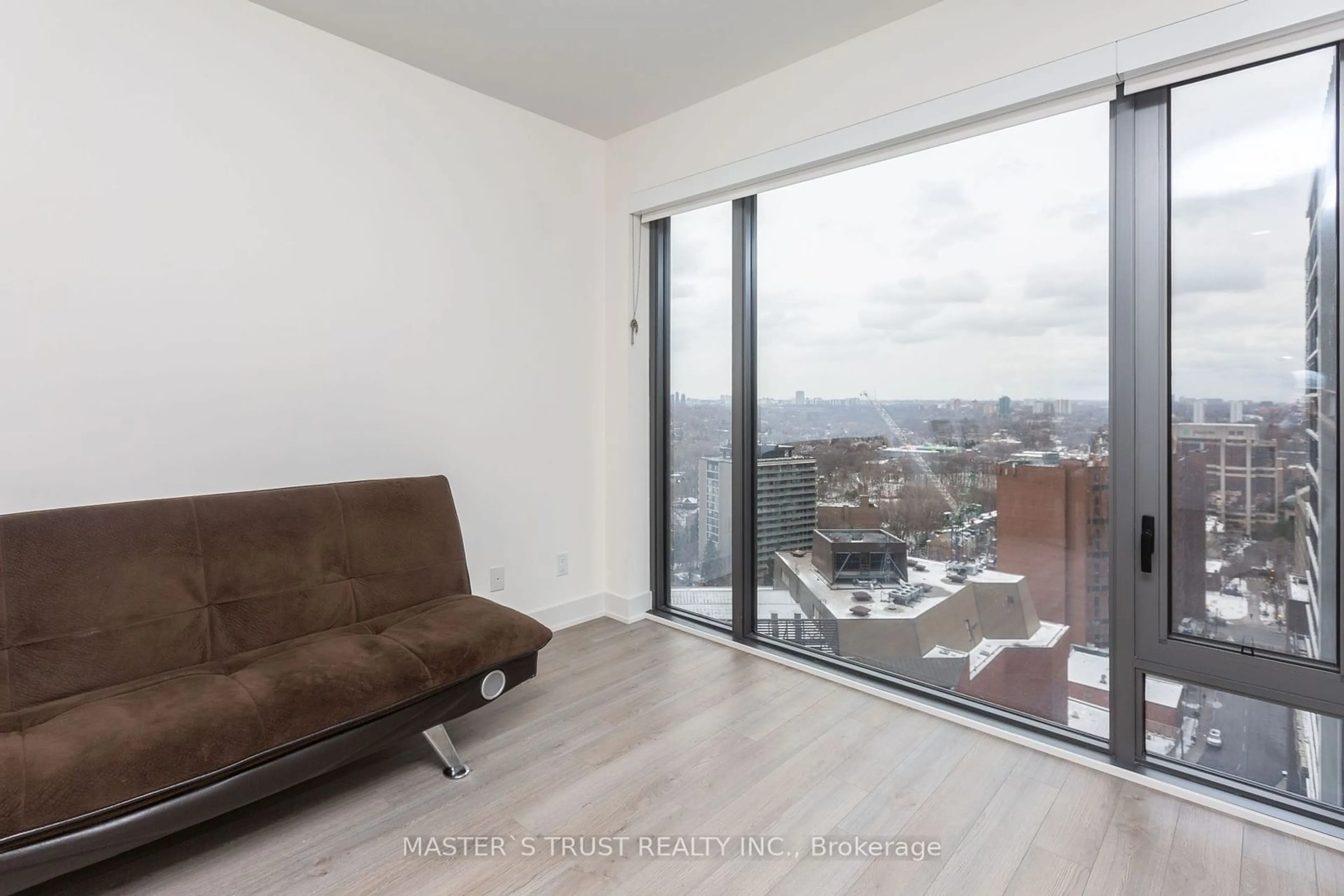 Living room with furniture, wood/laminate floor for 8 Cumberland St #2006, Toronto Ontario M4W 0B6