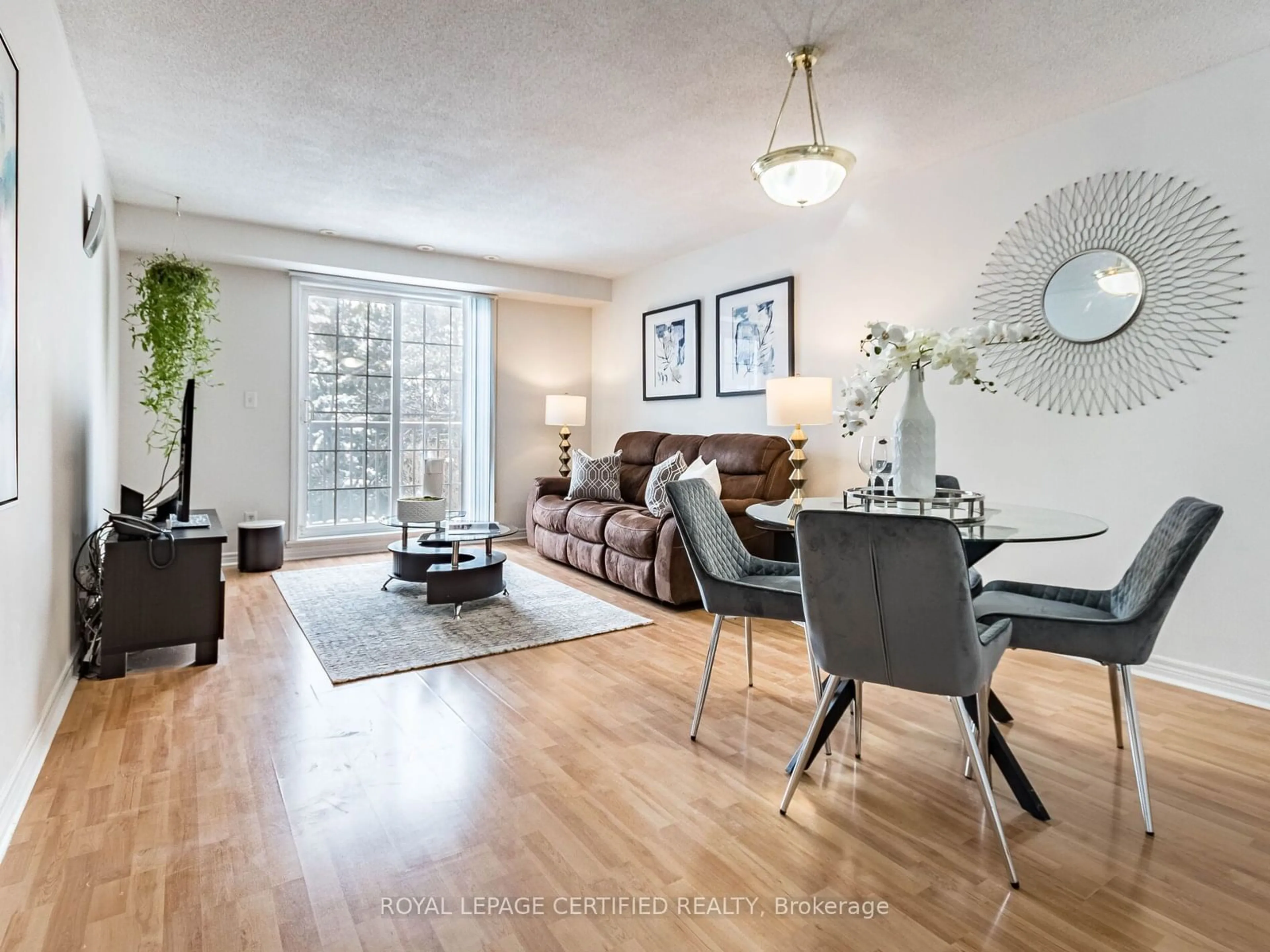 Living room with furniture, wood/laminate floor for 55 Cedarcroft Blvd #6, Toronto Ontario M2R 3Y1