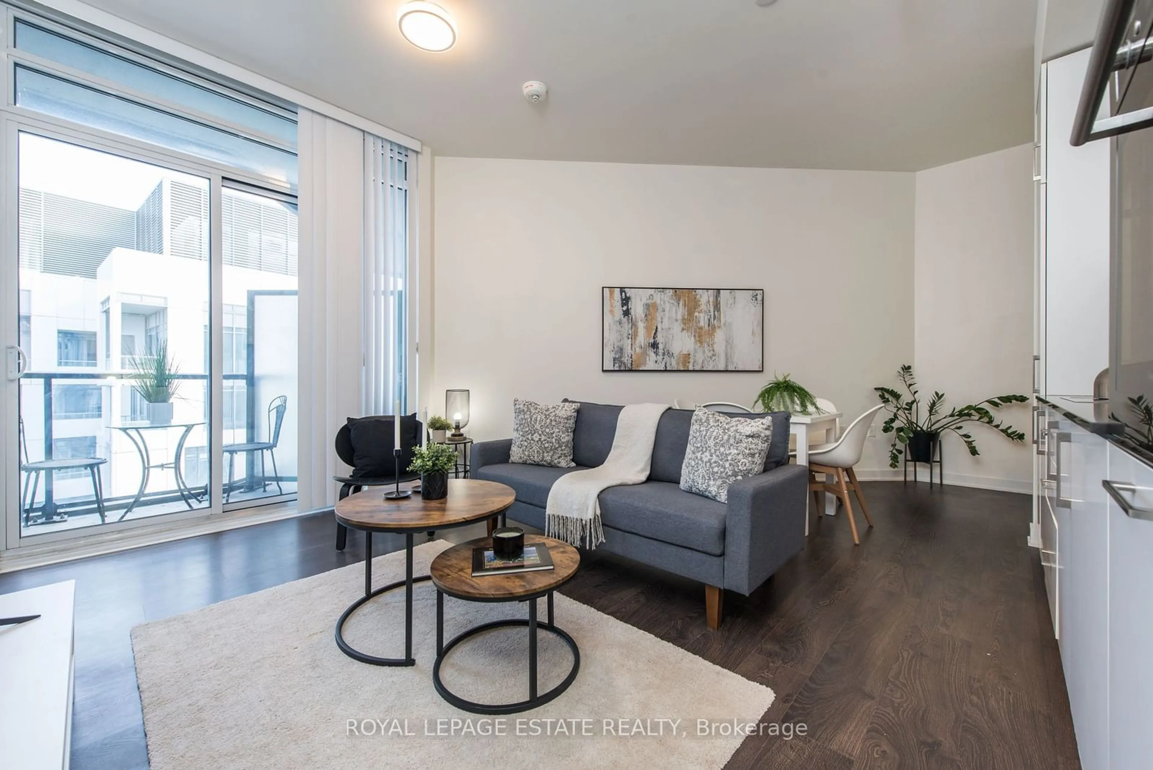 Living room with furniture, wood/laminate floor for 27 Bathurst St #1818, Toronto Ontario M5V 0R1