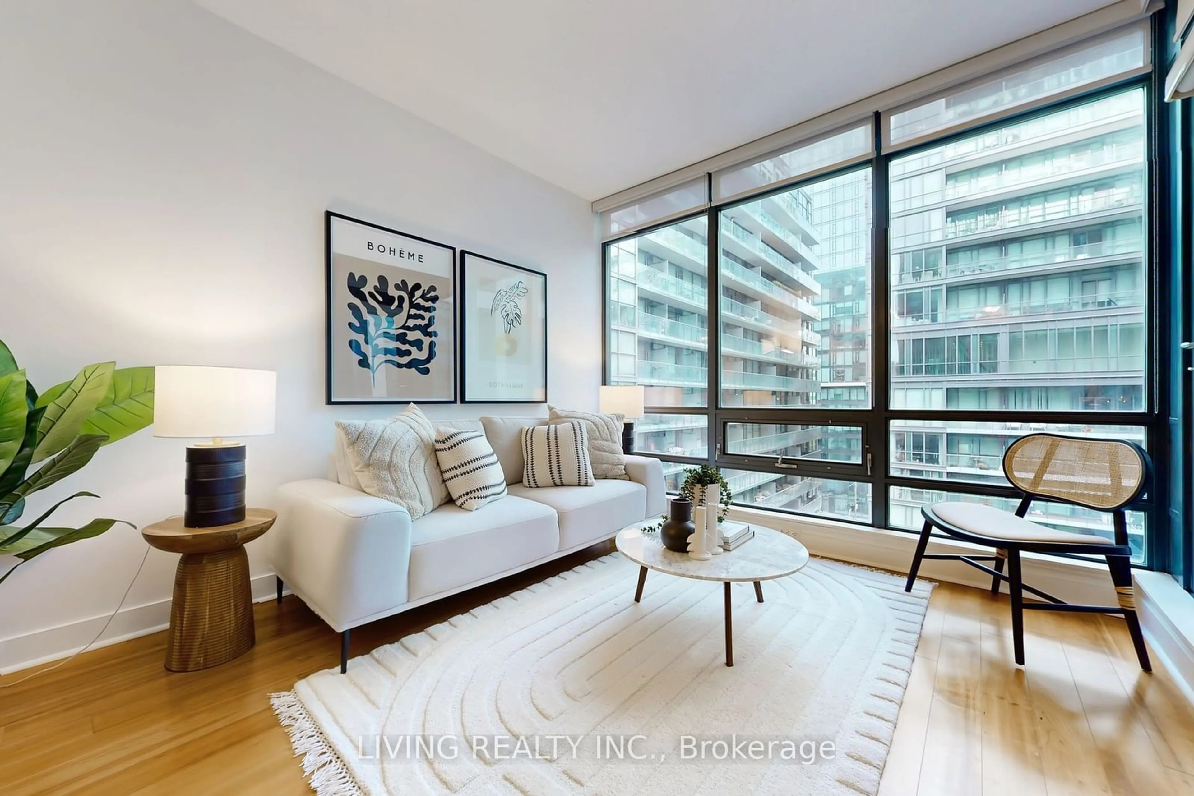 Living room with furniture, wood/laminate floor for 438 King St #703, Toronto Ontario M5V 3T9