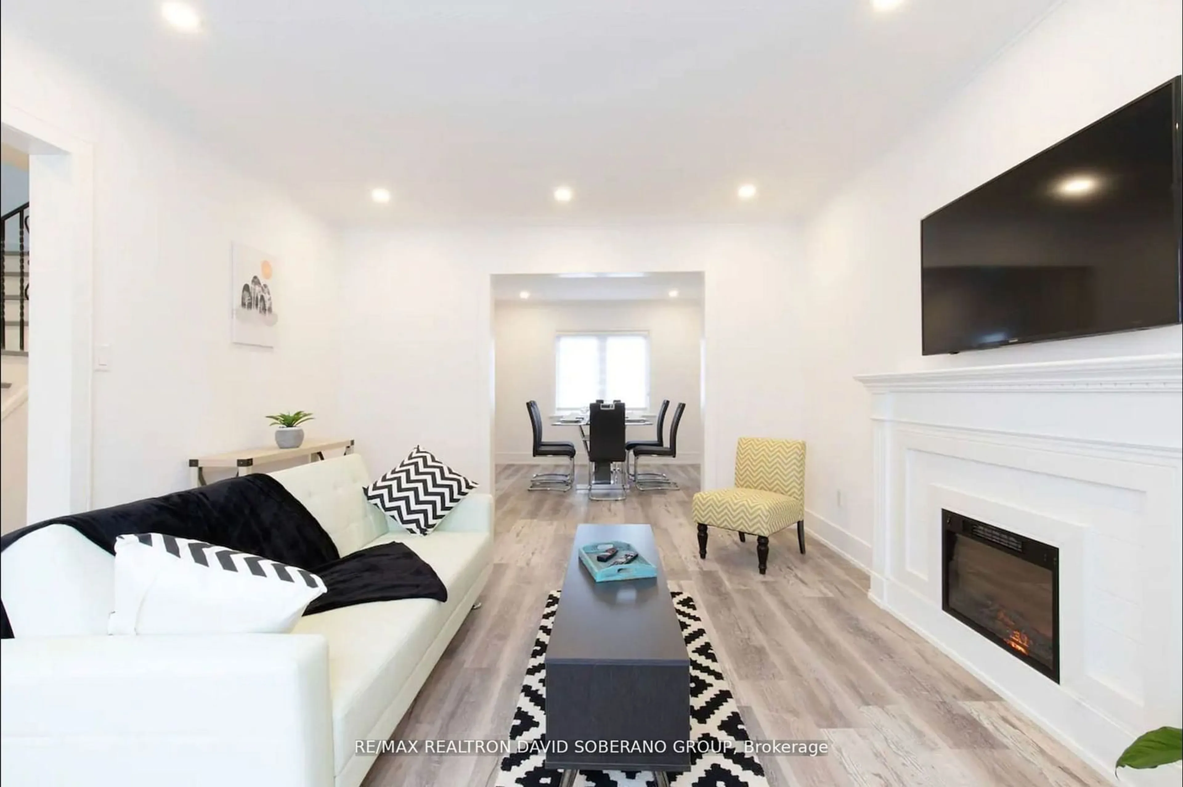 Living room with furniture, wood/laminate floor for 55 Raeburn Ave, Toronto Ontario M3H 1G9