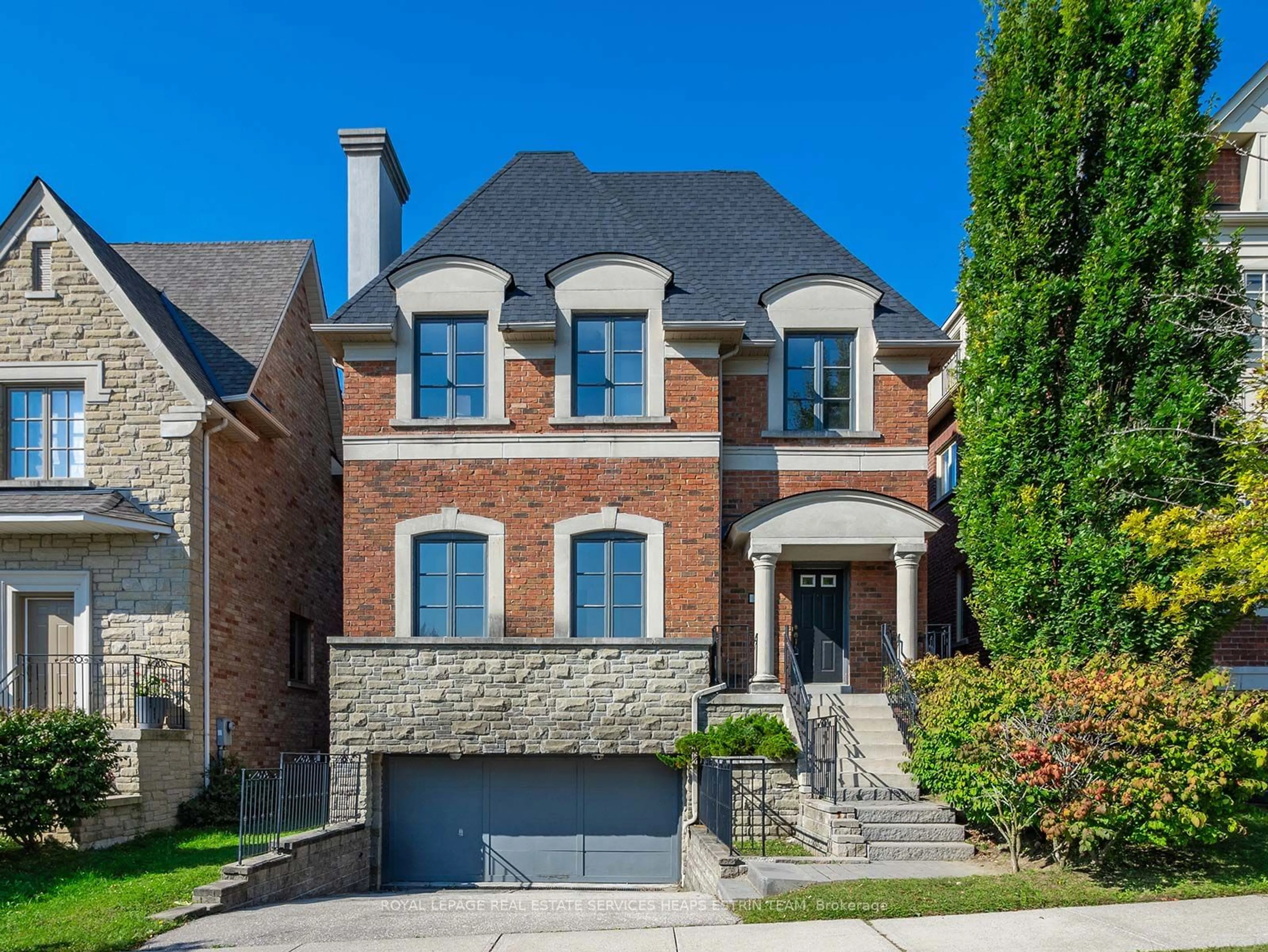 Home with brick exterior material, street for 42 True Davidson Dr, Toronto Ontario M4W 3X5