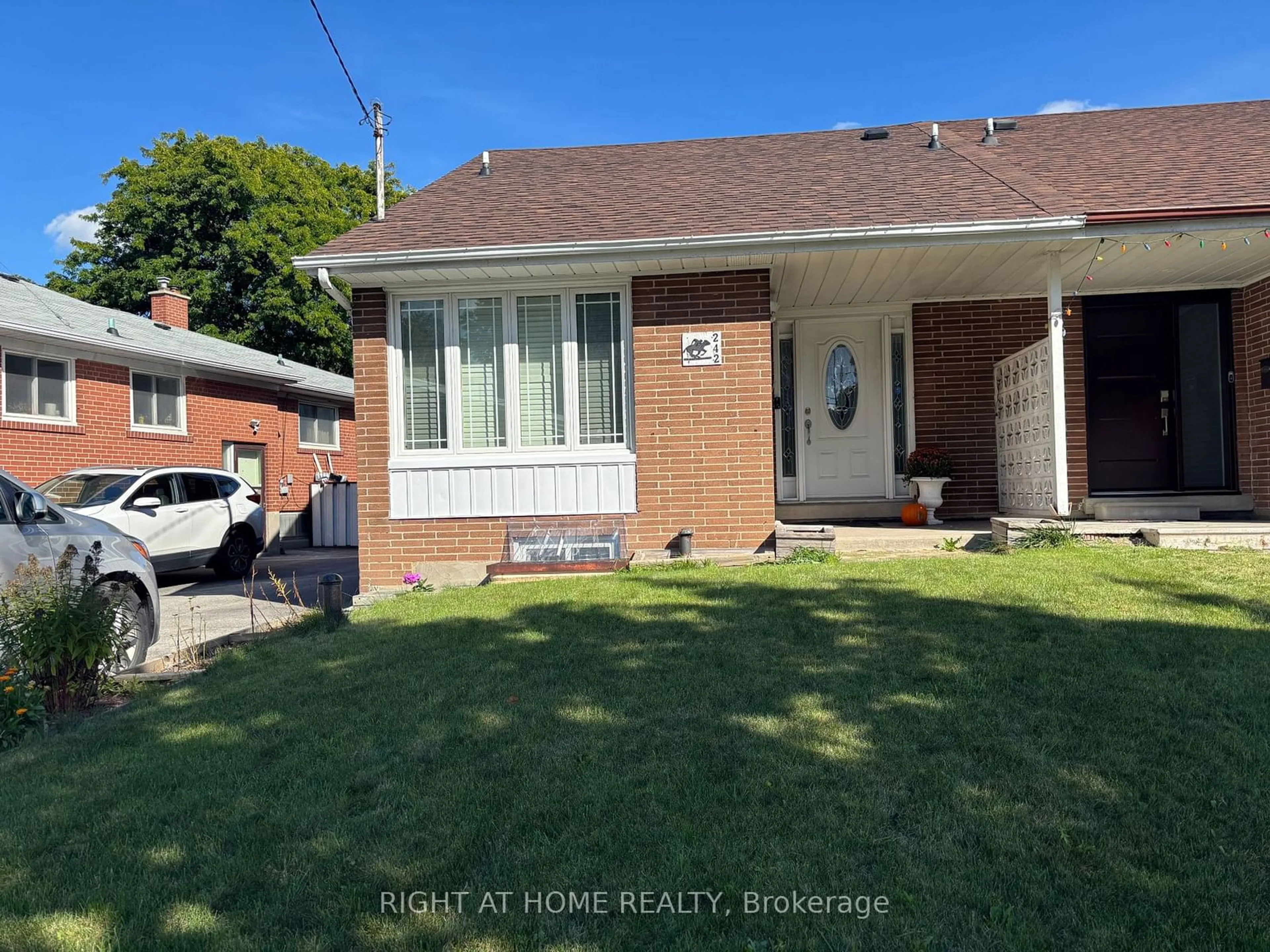 Home with brick exterior material, street for 242 Roywood Dr, Toronto Ontario M3A 2E6