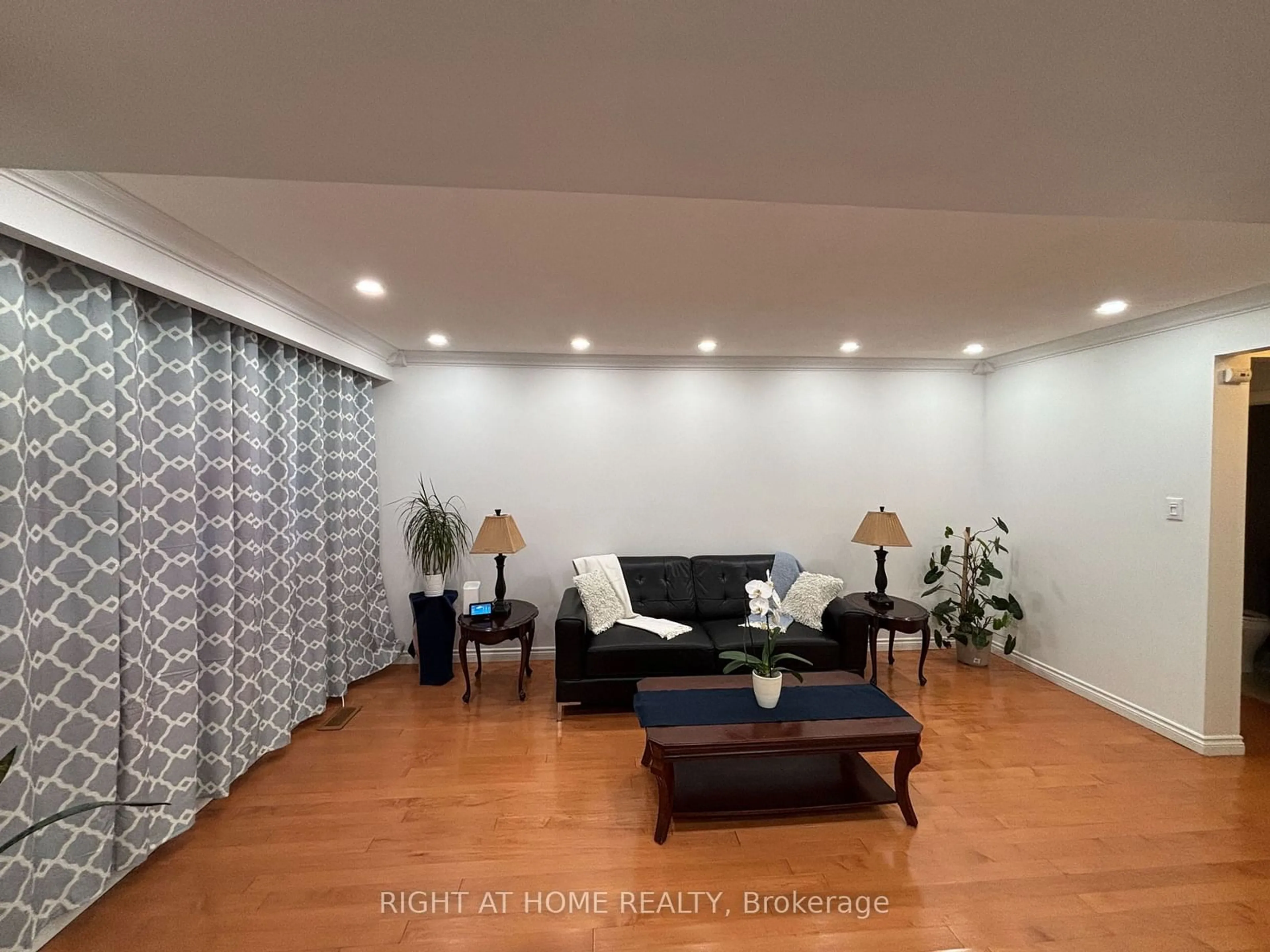 Living room with furniture, wood/laminate floor for 242 Roywood Dr, Toronto Ontario M3A 2E6