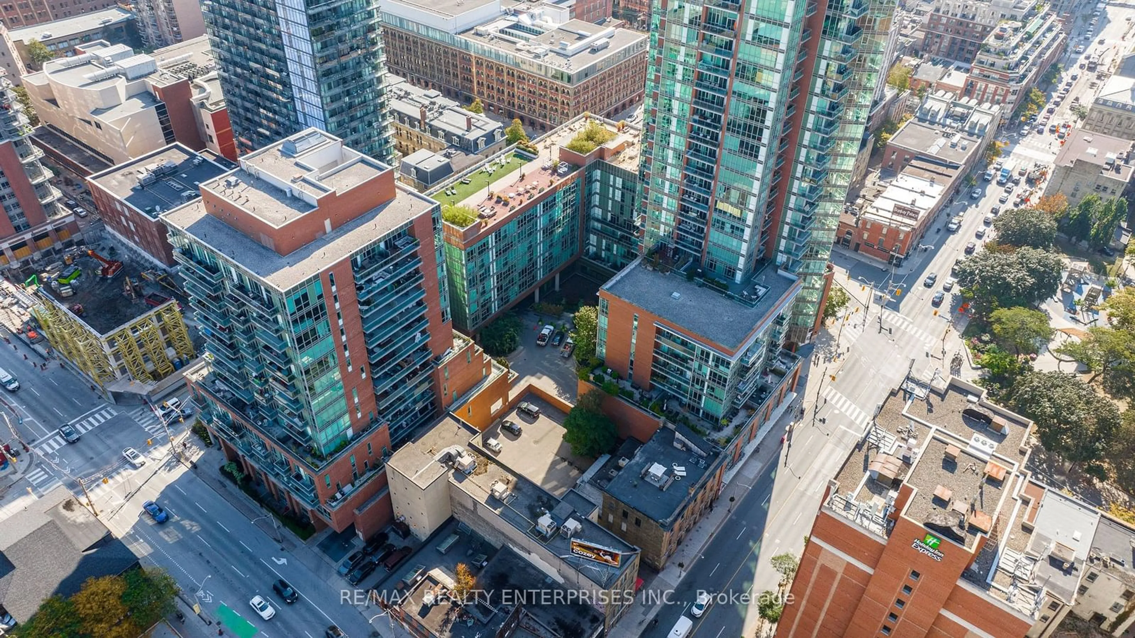 A pic from outside/outdoor area/front of a property/back of a property/a pic from drone, city buildings view from balcony for 112 George St #902, Toronto Ontario M5A 2M5