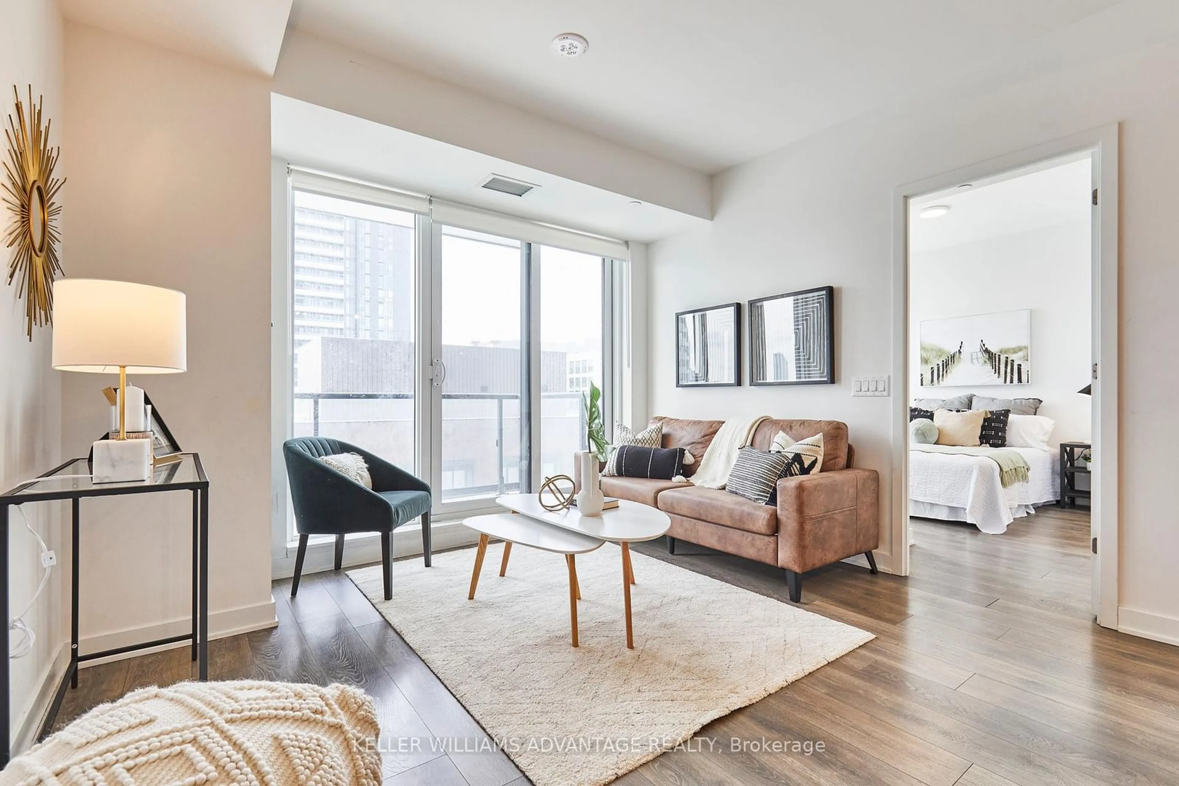 Living room with furniture, wood/laminate floor for 130 River St #1304, Toronto Ontario M5A 0R8