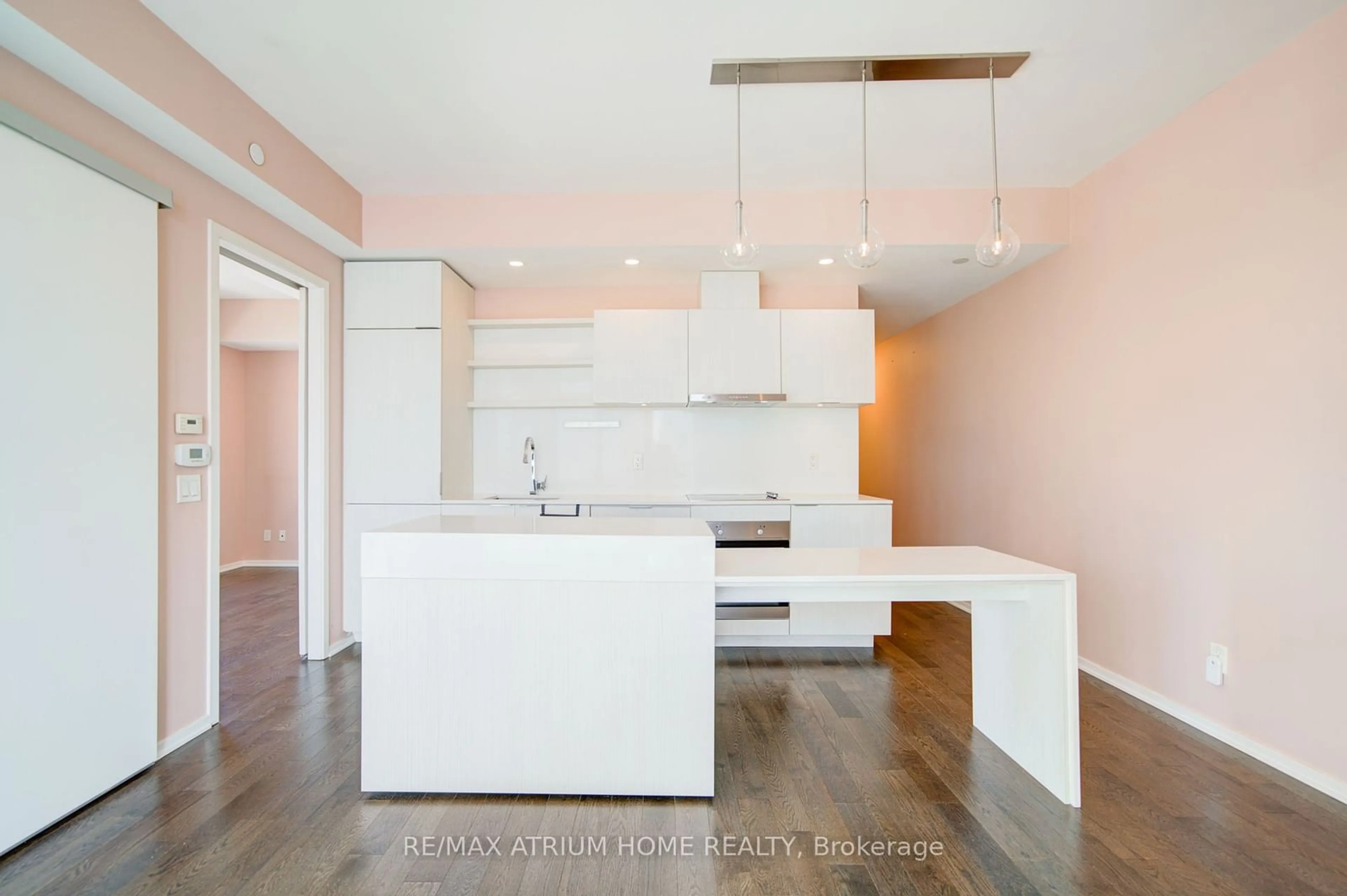 Open concept kitchen, wood/laminate floor for 16 Bonnycastle St #1402, Toronto Ontario M5A 0C9