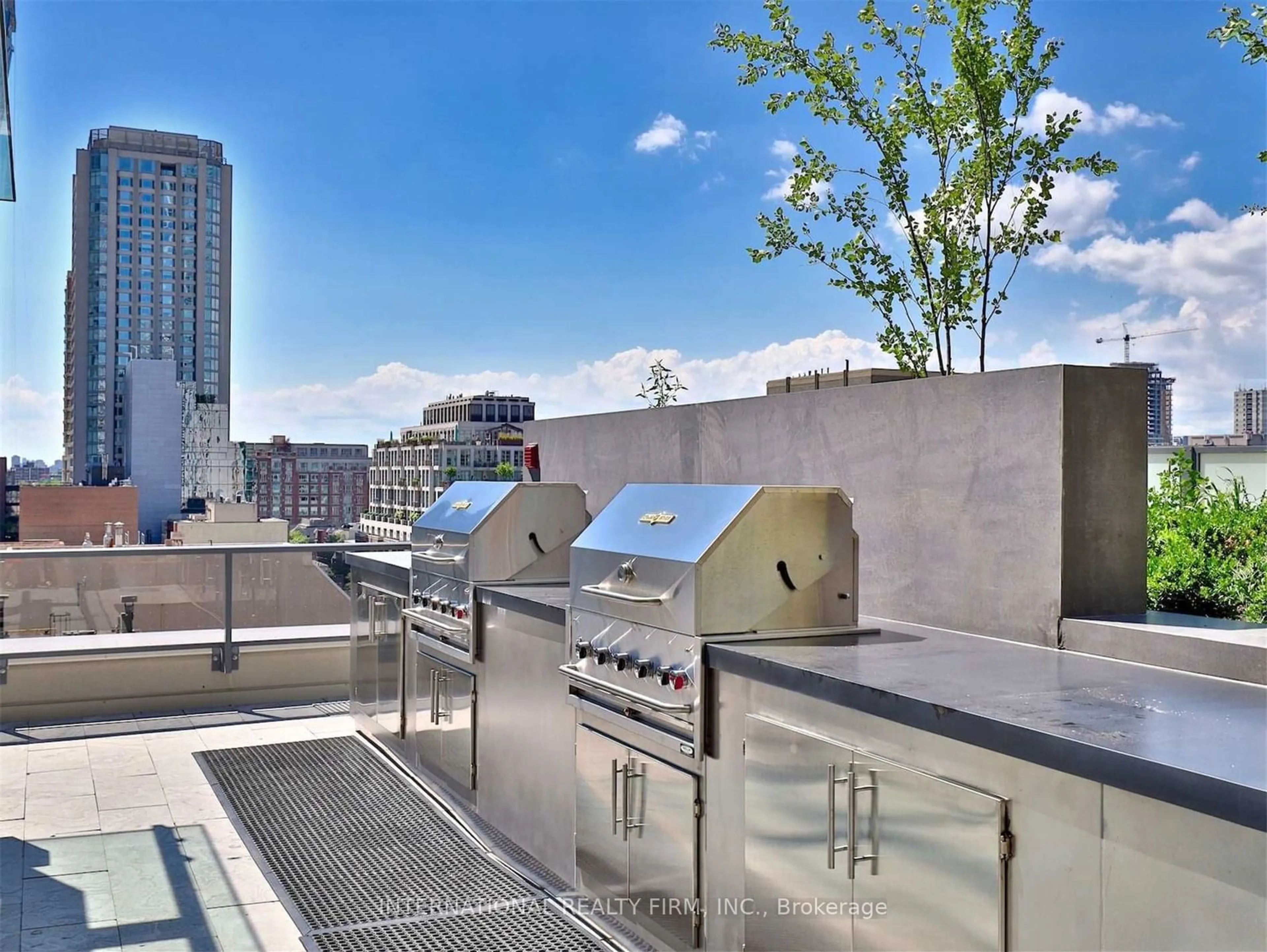 Patio, city buildings view from balcony for 88 Cumberland St #808, Toronto Ontario M5R 1A3