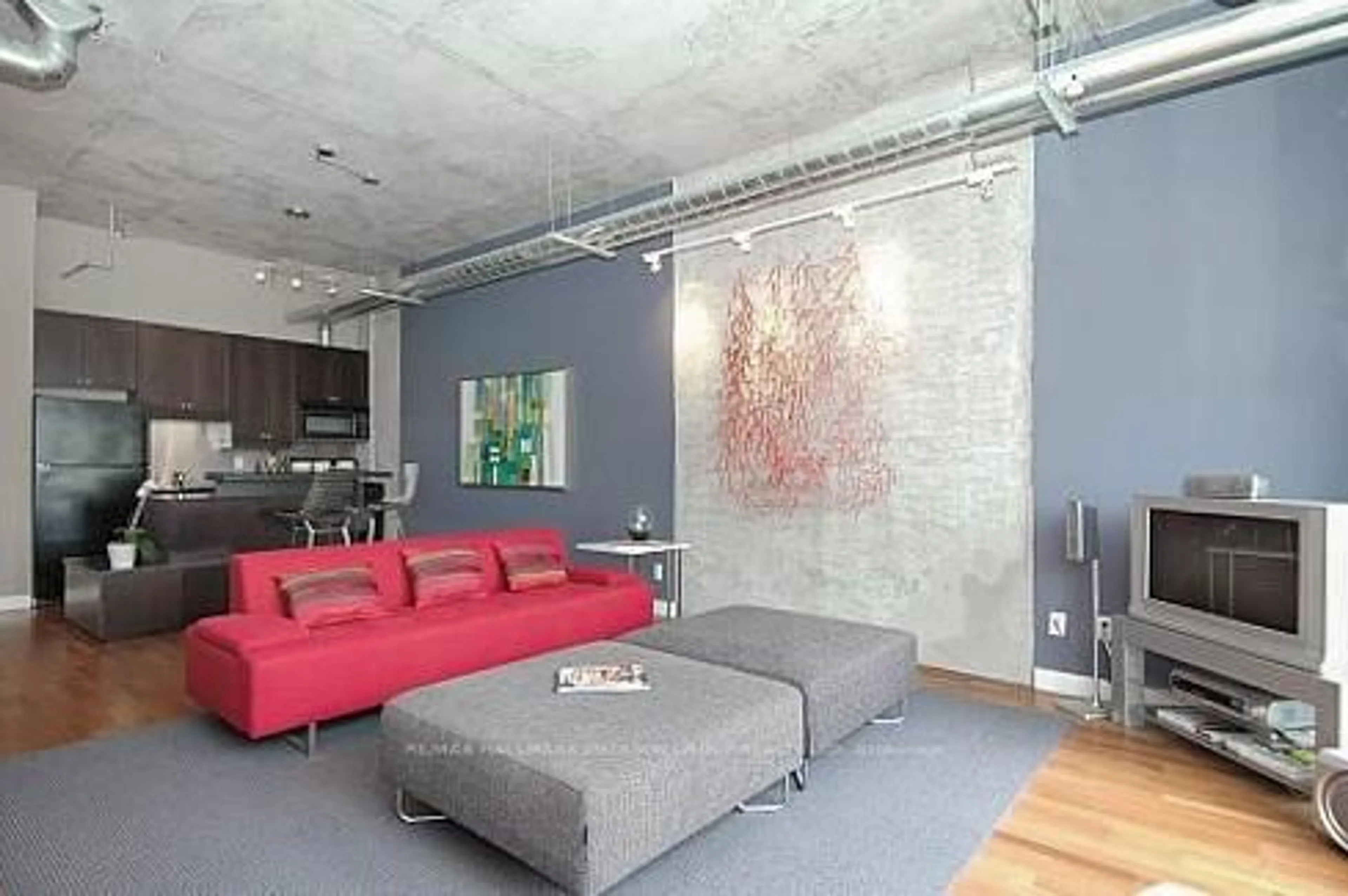 Living room with furniture, cement floor for 261 King St #408, Toronto Ontario M5A 4T6