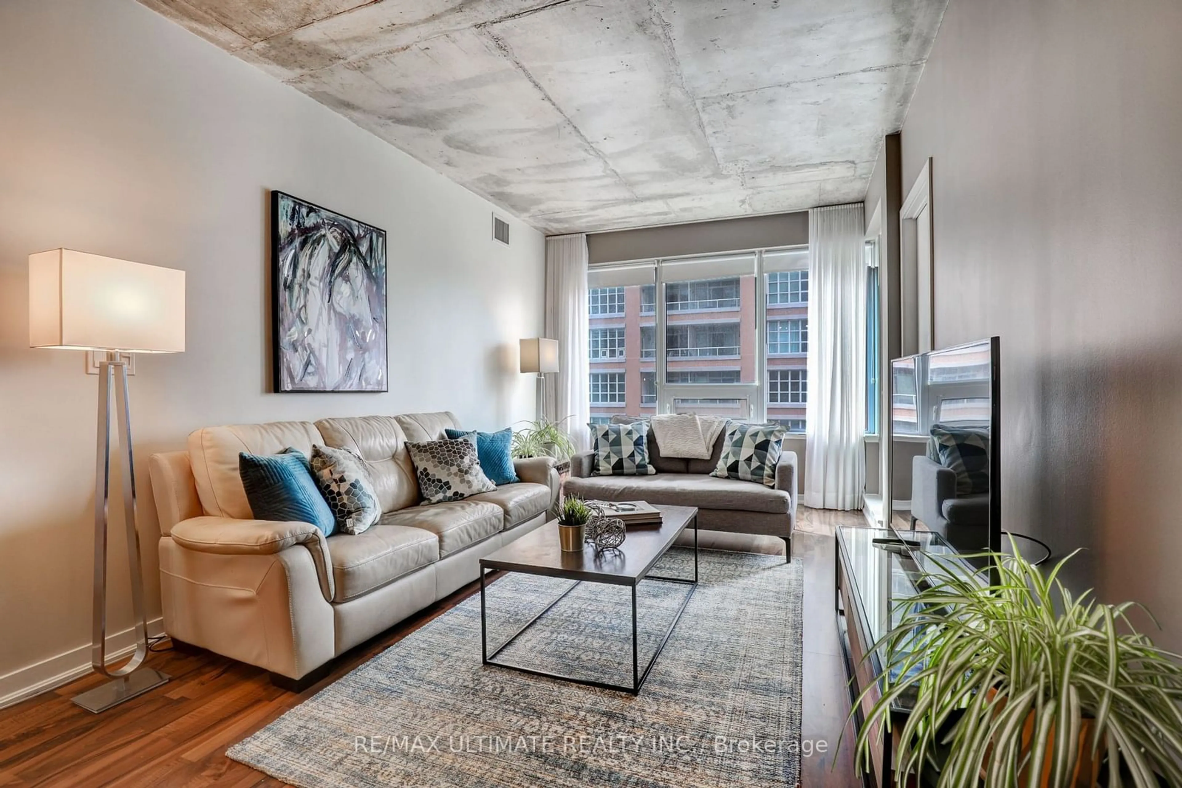 Living room with furniture, cement floor for 59 East Liberty St #707, Toronto Ontario M6K 3R1