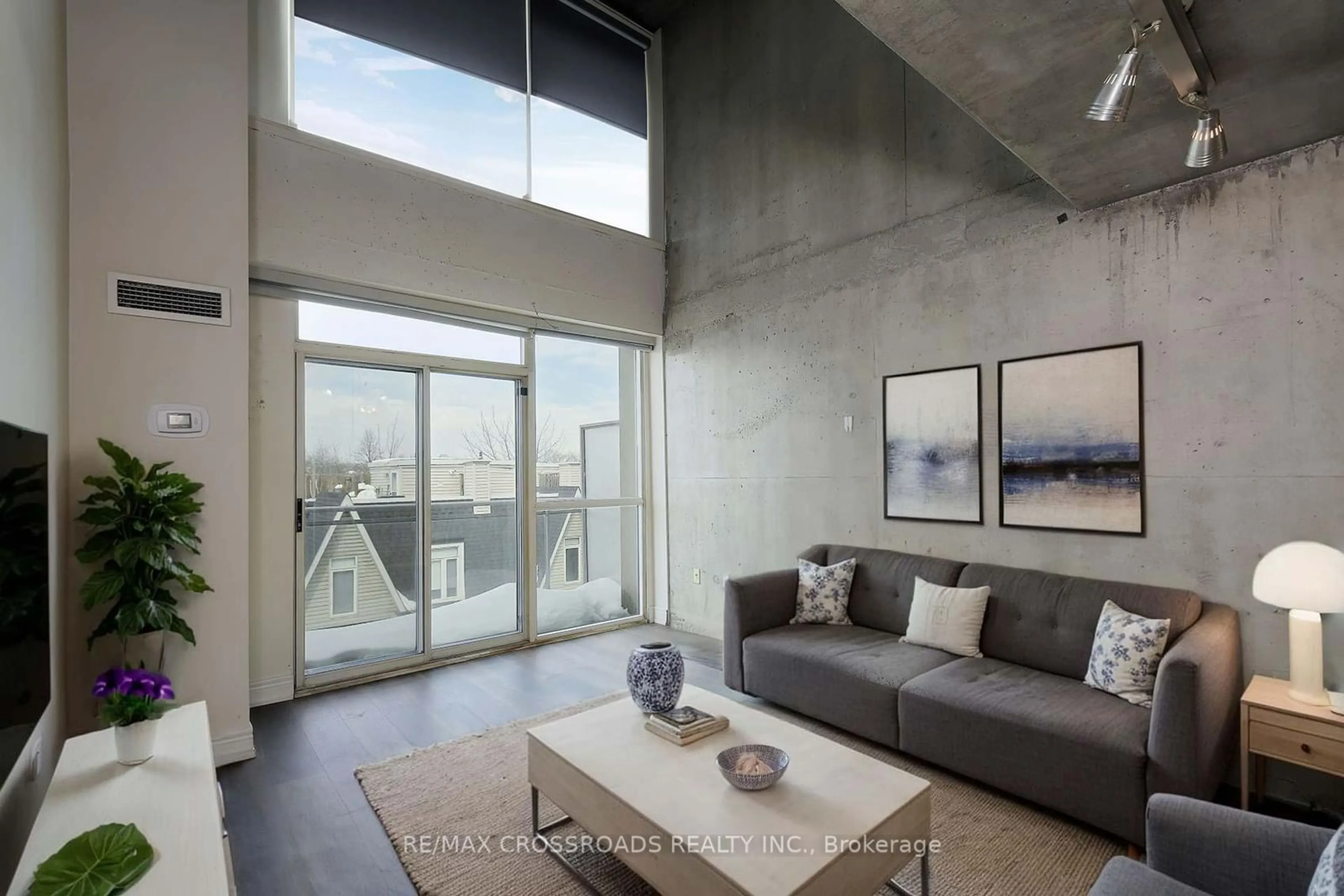 Living room with furniture, cement floor for 954 King St #526, Toronto Ontario M6K 1E5