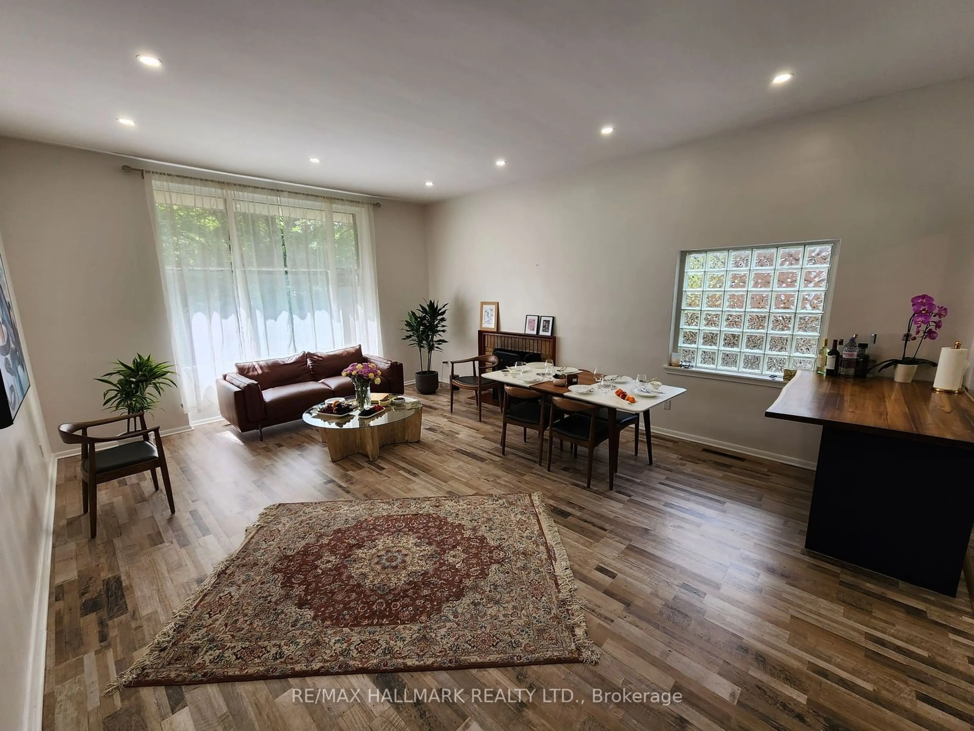 Living room with furniture, wood/laminate floor for 10 Ternhill Cres, Toronto Ontario M3C 2E5