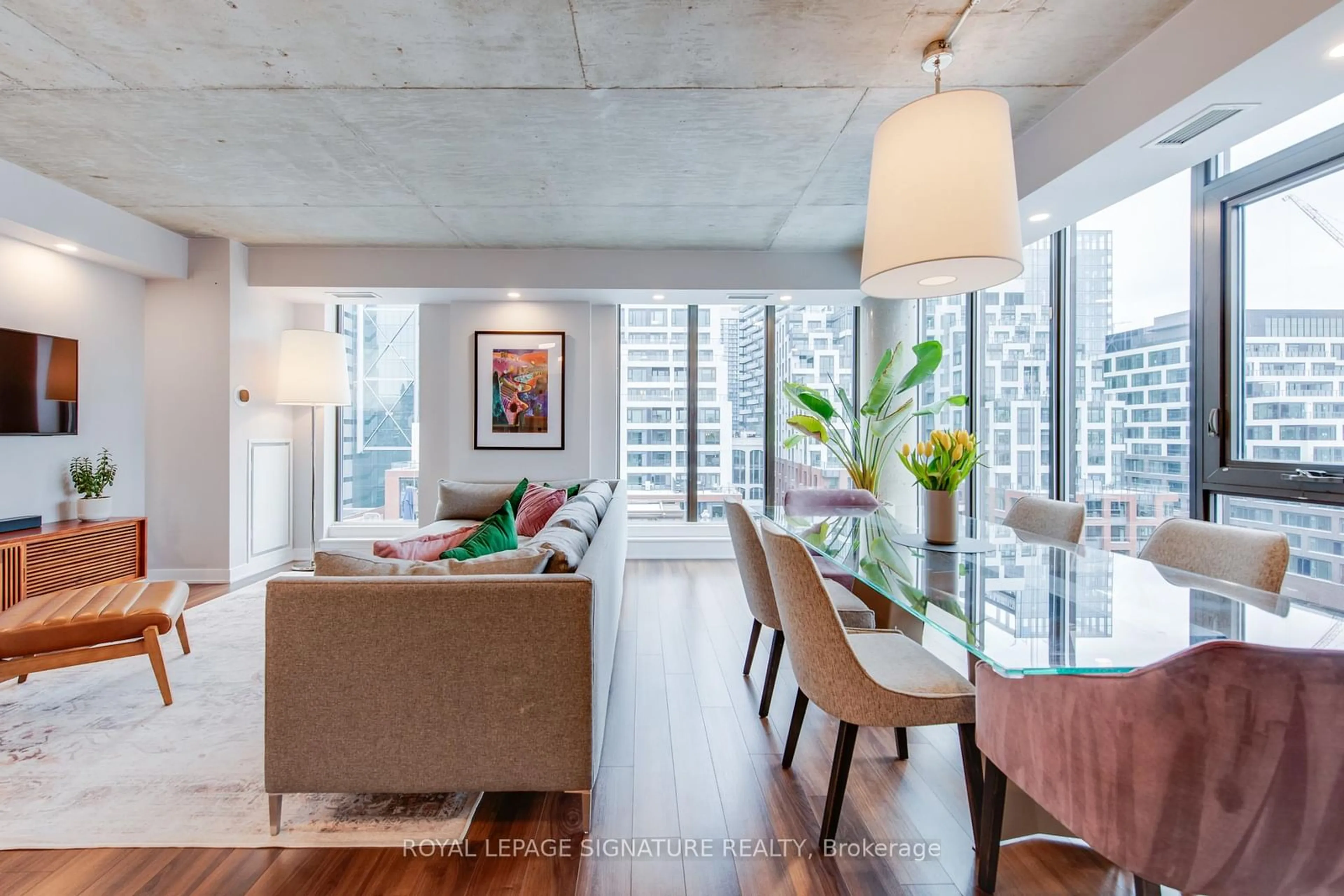 Living room with furniture, cement floor for 400 Wellington St #PH1106, Toronto Ontario M5V 0B5