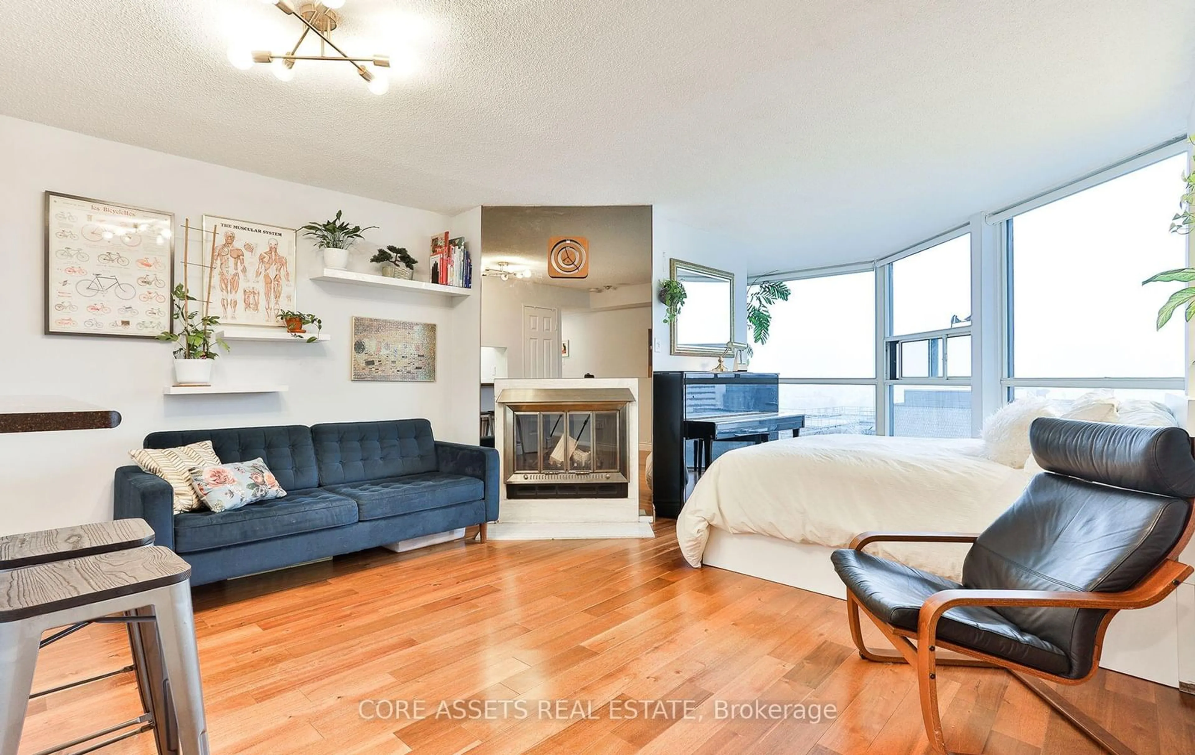 Living room with furniture, wood/laminate floor for 705 King St #1906, Toronto Ontario M5V 2W8