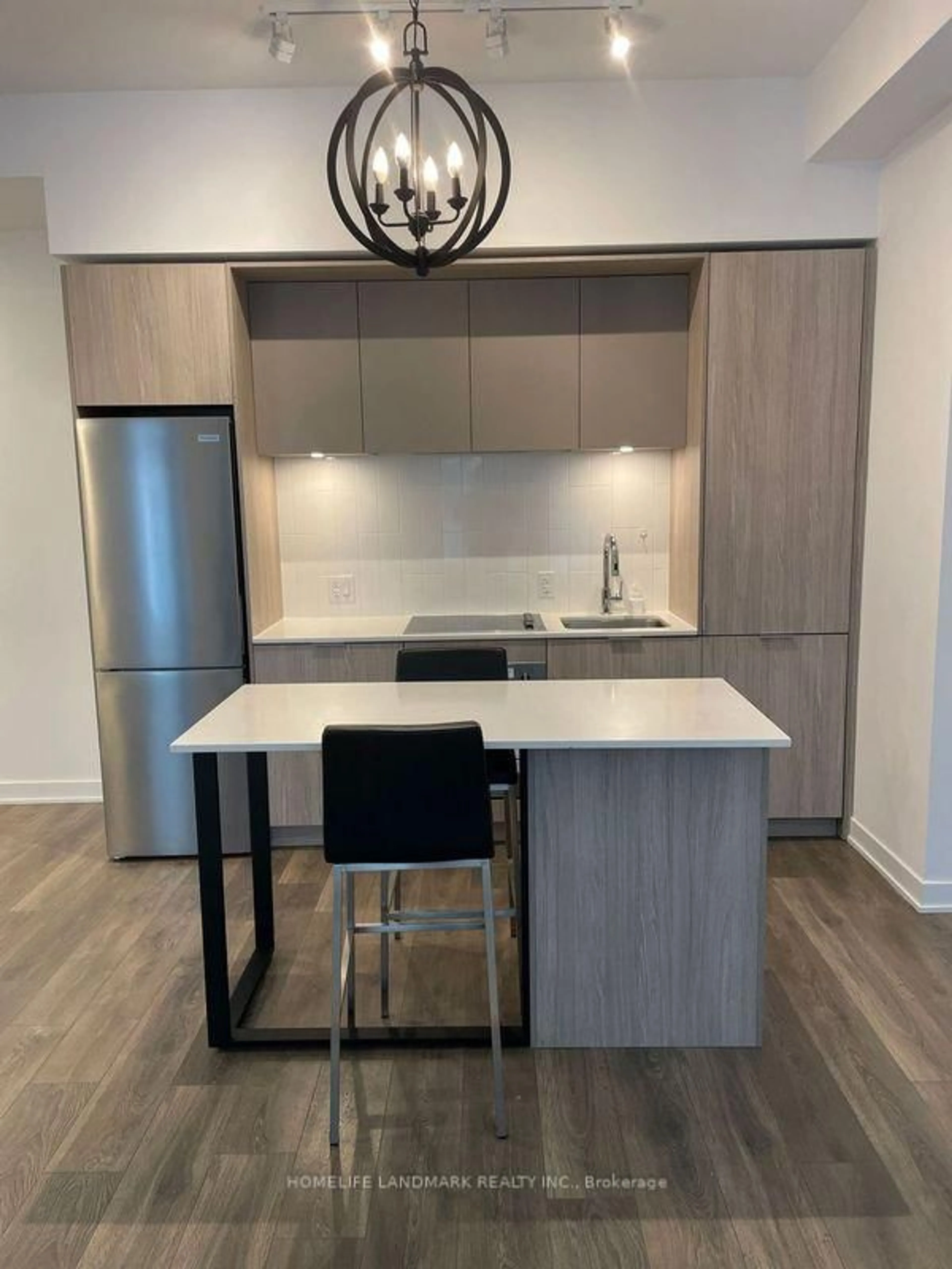 Open concept kitchen, wood/laminate floor for 35 Tubman Ave #318, Toronto Ontario M5A 0T1