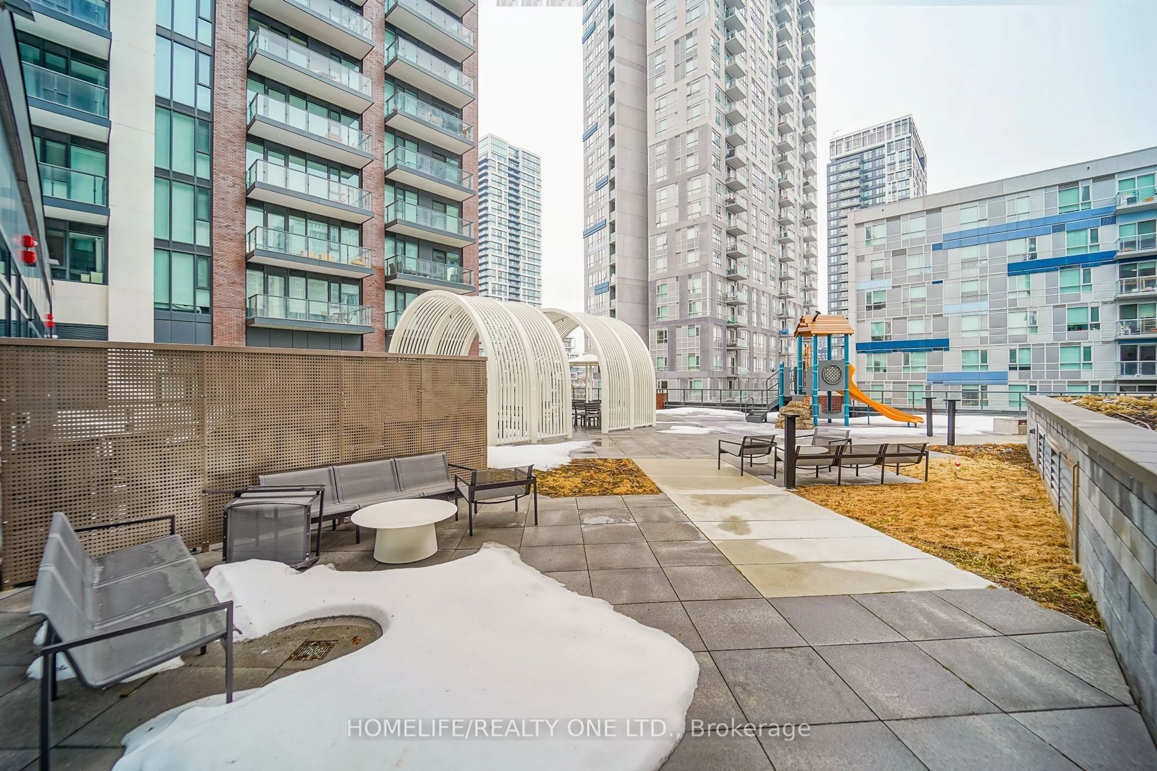 Patio, city buildings view from balcony for 130 River St #2002, Toronto Ontario M5A 0R8