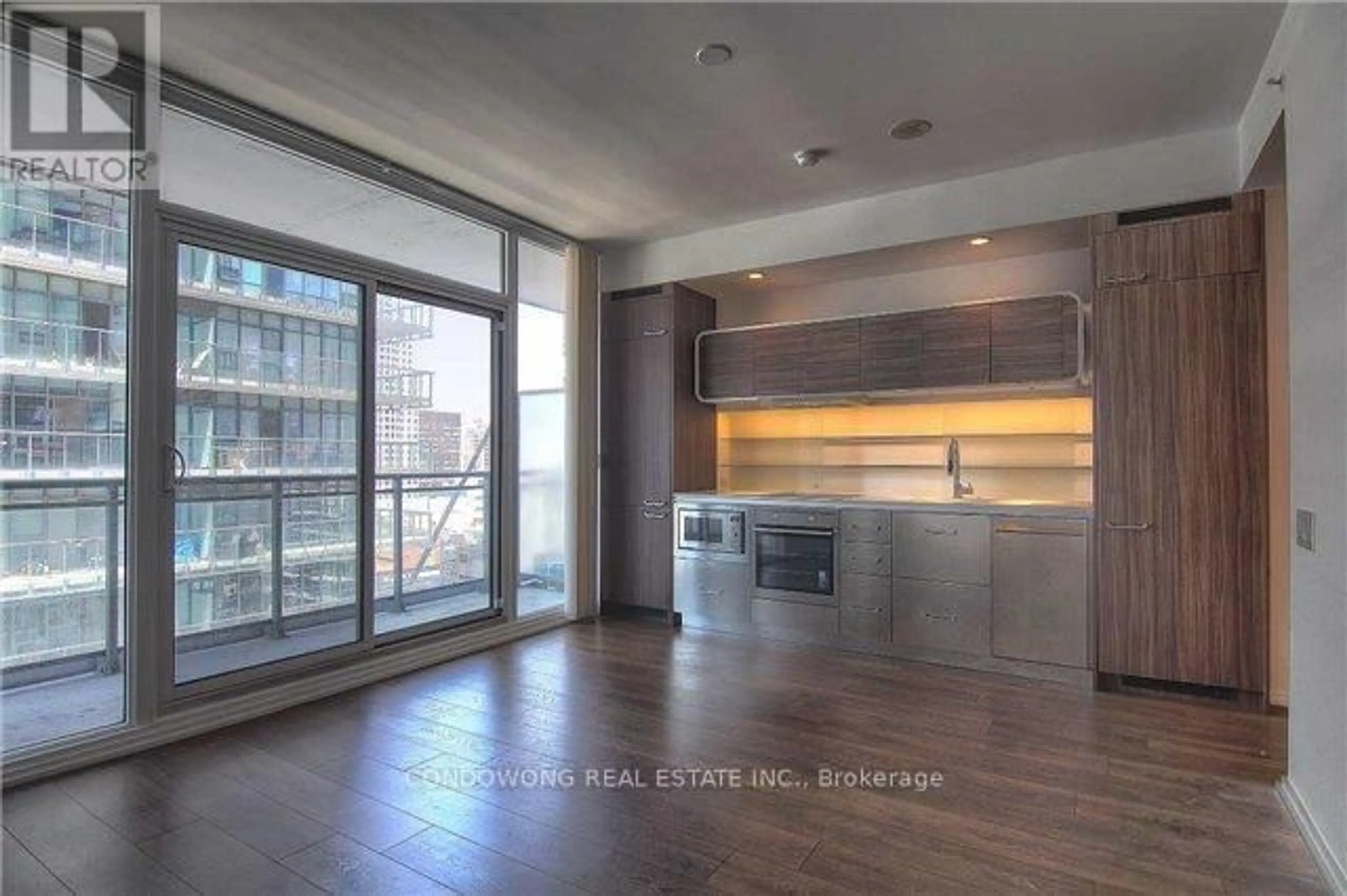 Open concept kitchen, wood/laminate floor for 45 Charles St #1103, Toronto Ontario M4Y 0B8