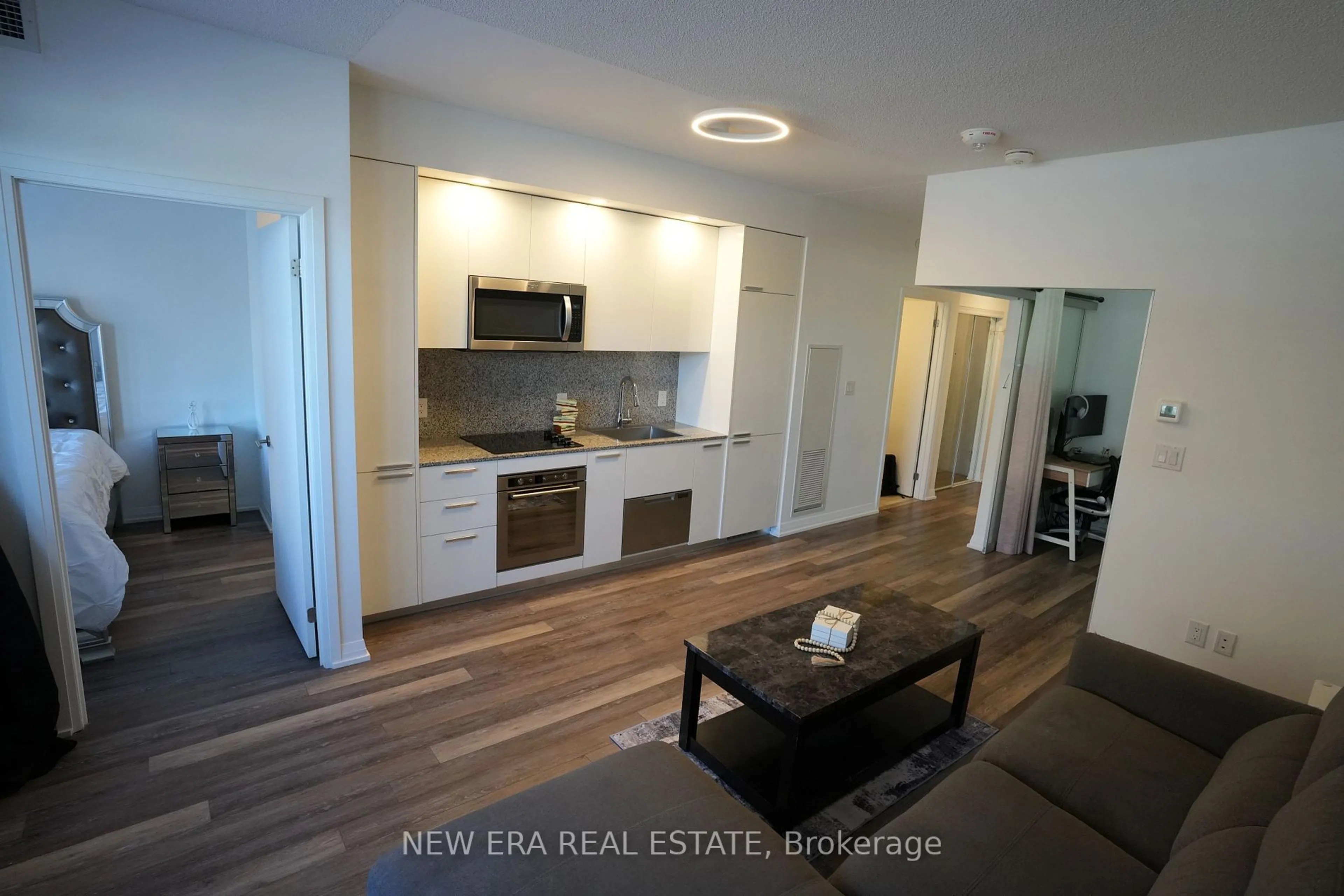 Open concept kitchen, wood/laminate floor for 75 Canterbury Pl #315, Toronto Ontario M2N 0L2