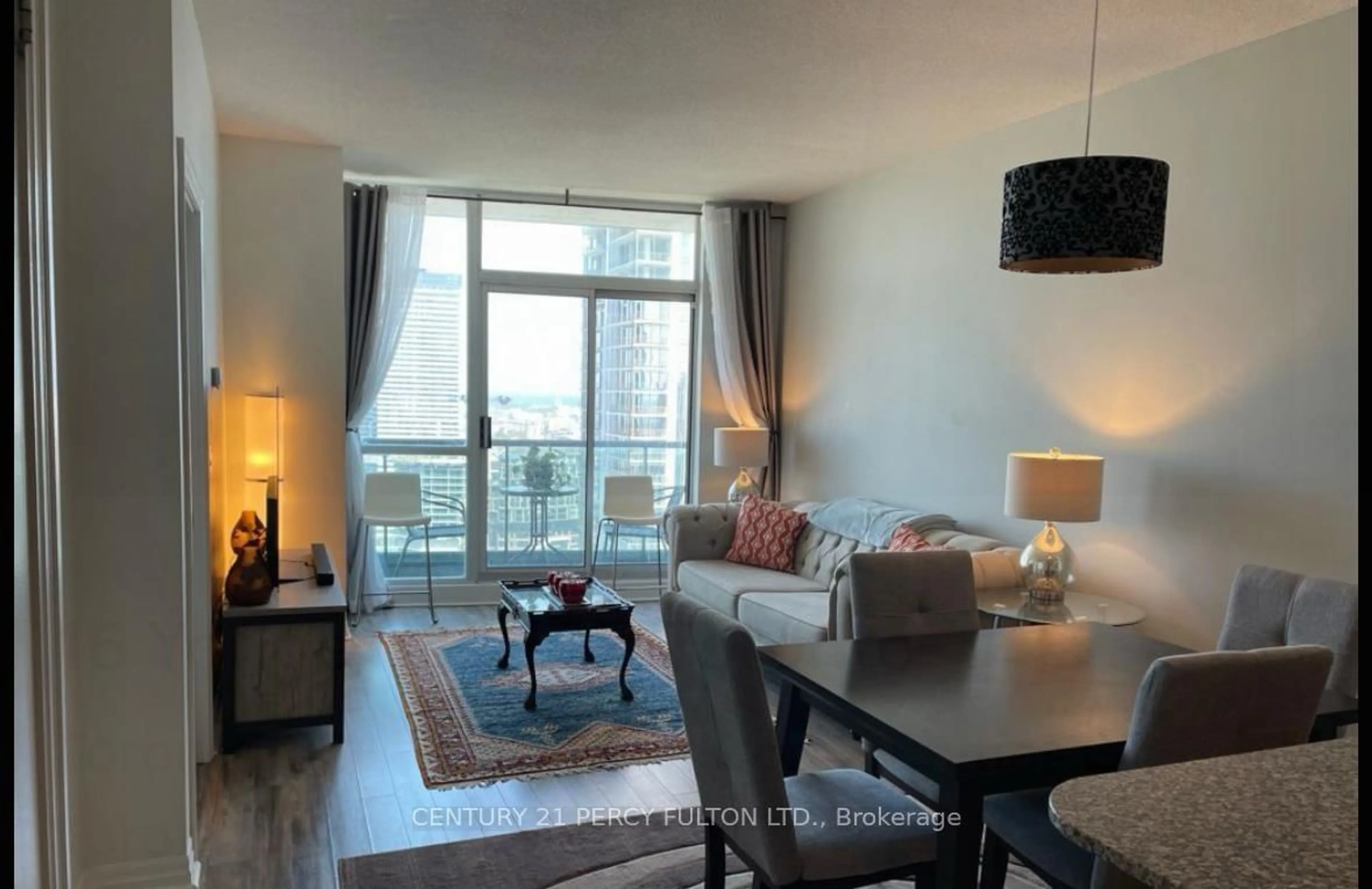 Living room with furniture, wood/laminate floor for 16 Yonge St #3407, Toronto Ontario M5E 1Z9