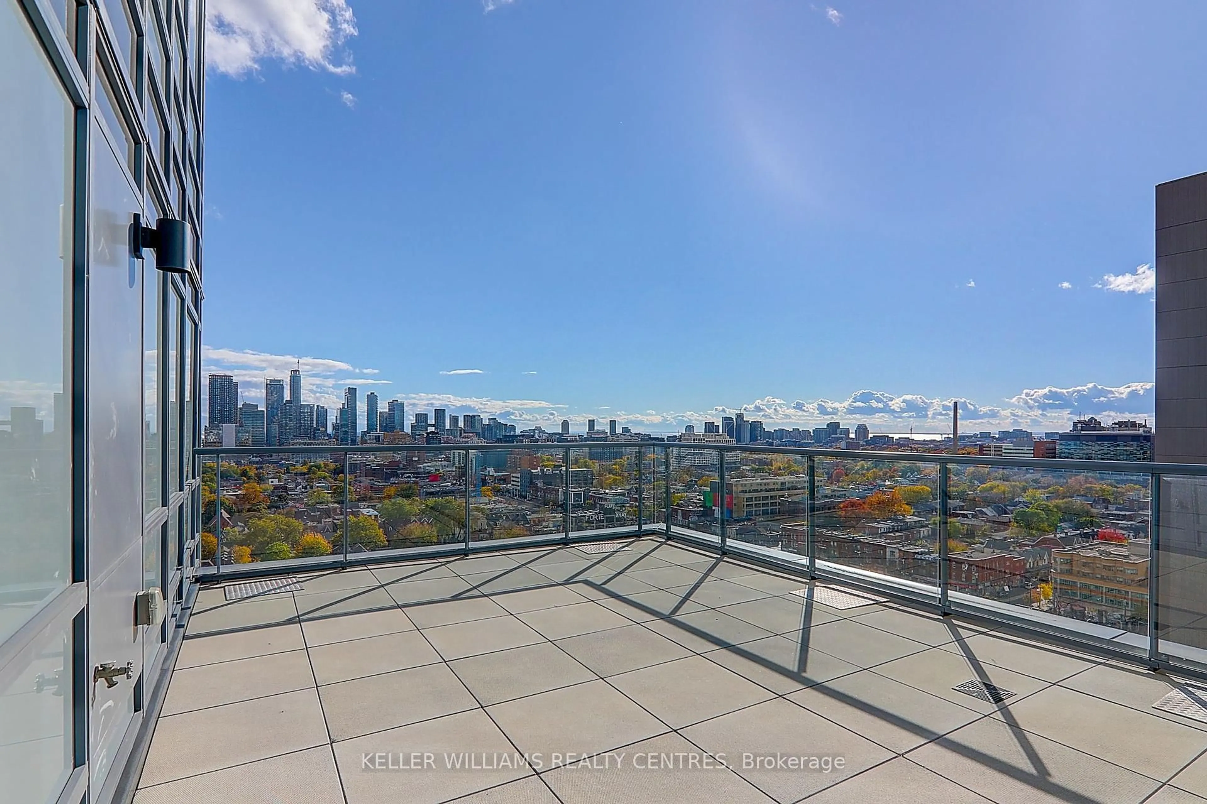 Patio, city buildings view from balcony for 181 Huron St #LPH03, Toronto Ontario M5T 0C1