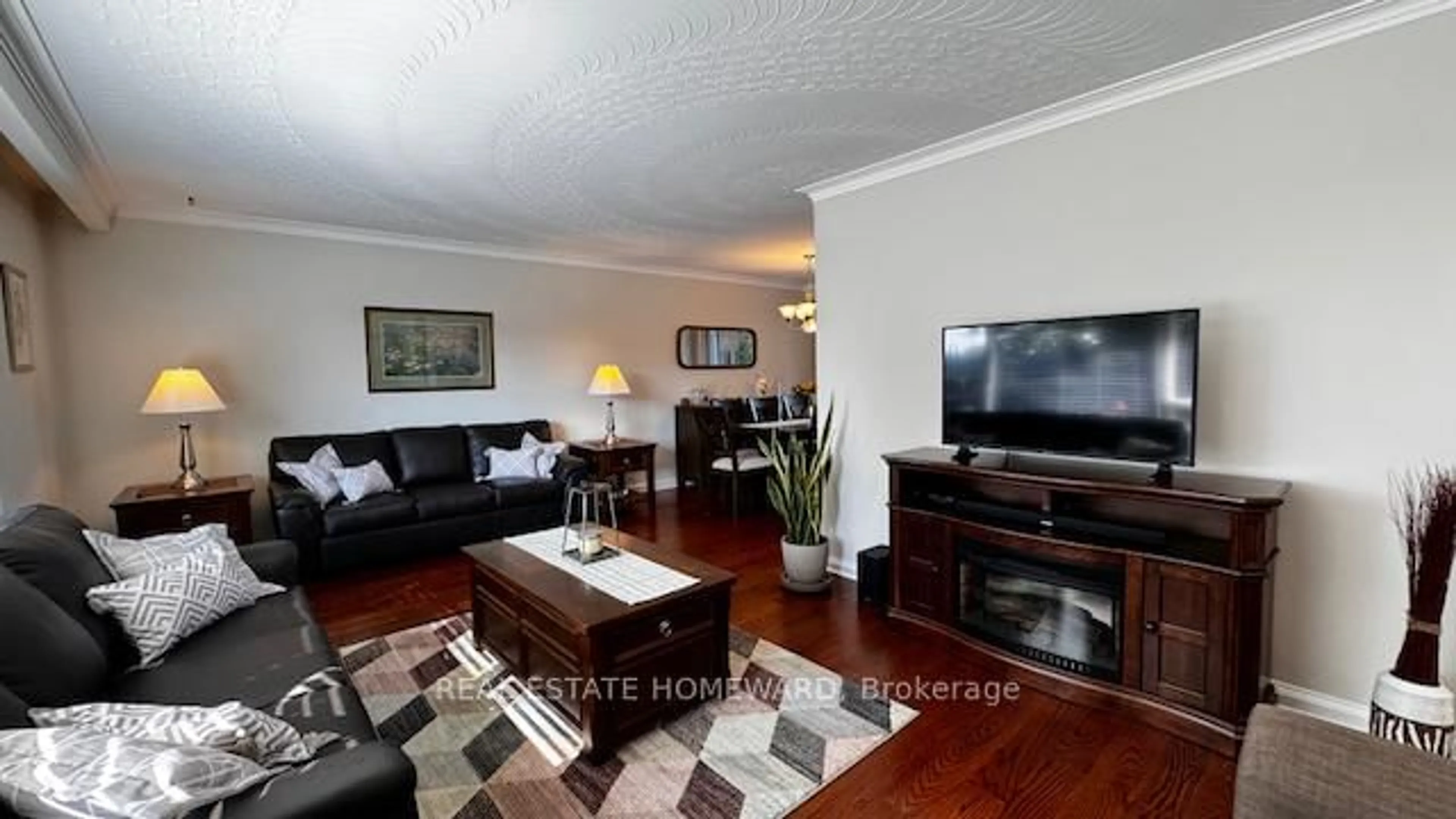 Living room with furniture, wood/laminate floor for 12 Kenewen Crt, Toronto Ontario M4A 1R8