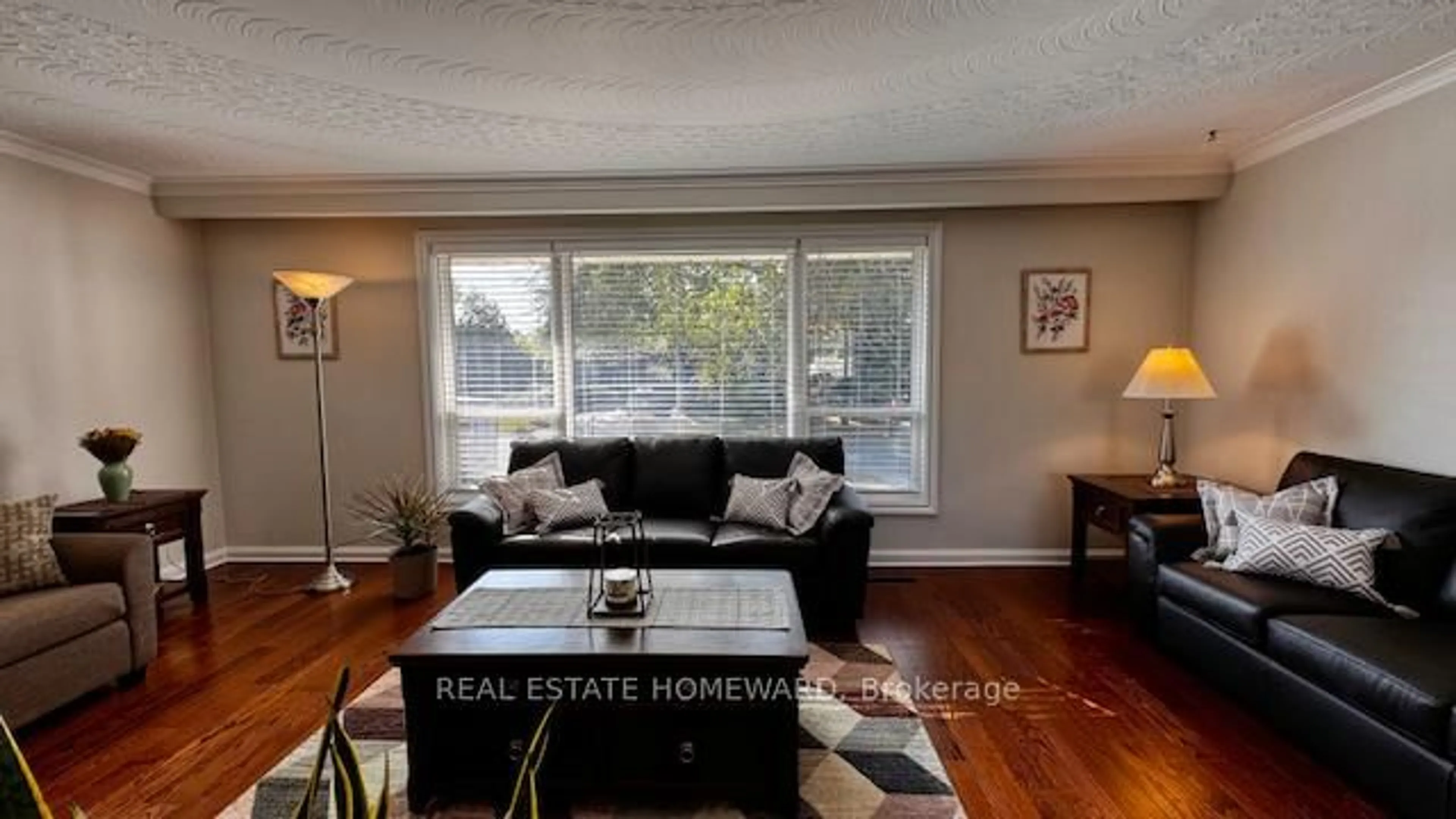 Living room with furniture, wood/laminate floor for 12 Kenewen Crt, Toronto Ontario M4A 1R8