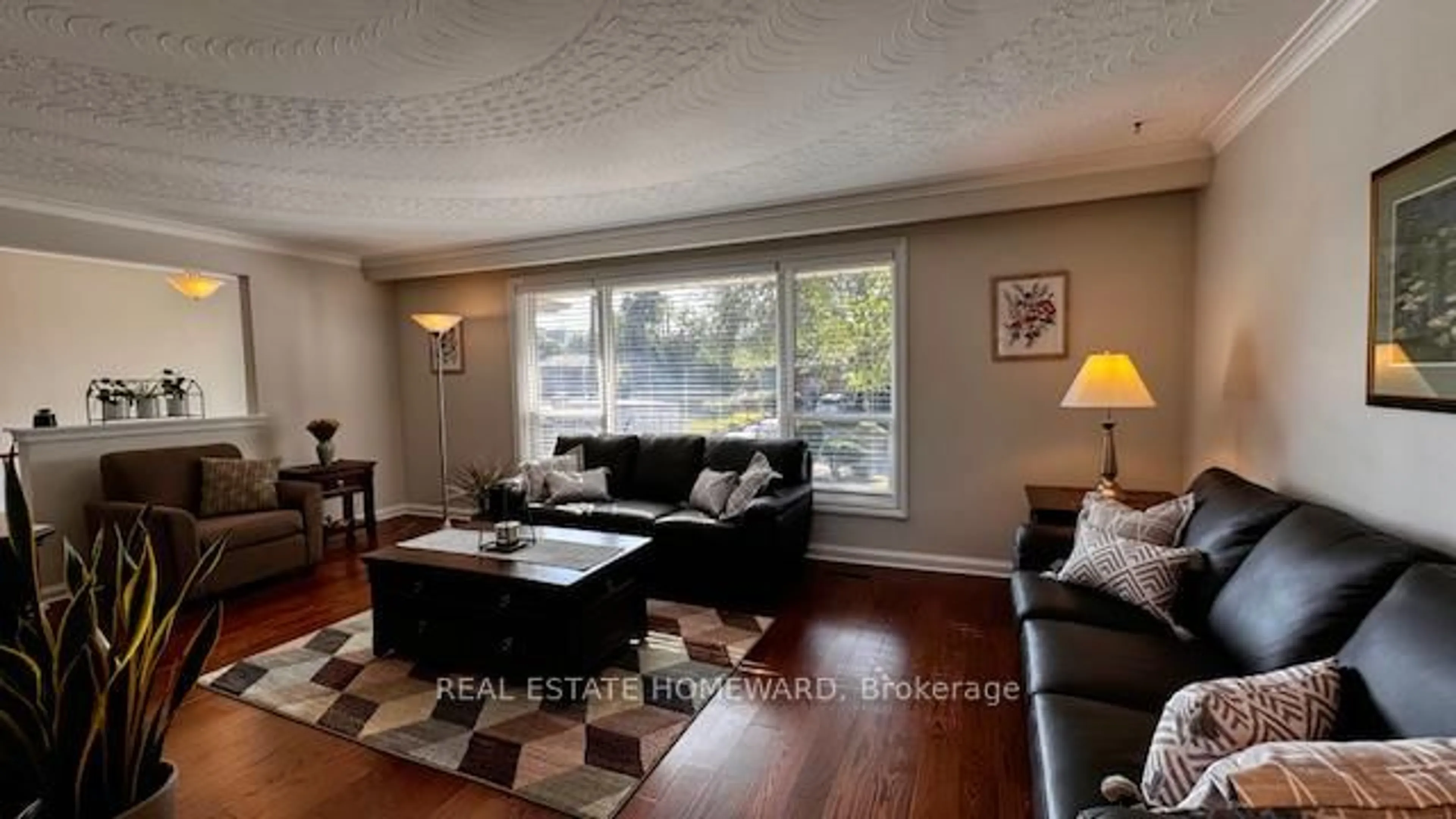 Living room with furniture, wood/laminate floor for 12 Kenewen Crt, Toronto Ontario M4A 1R8