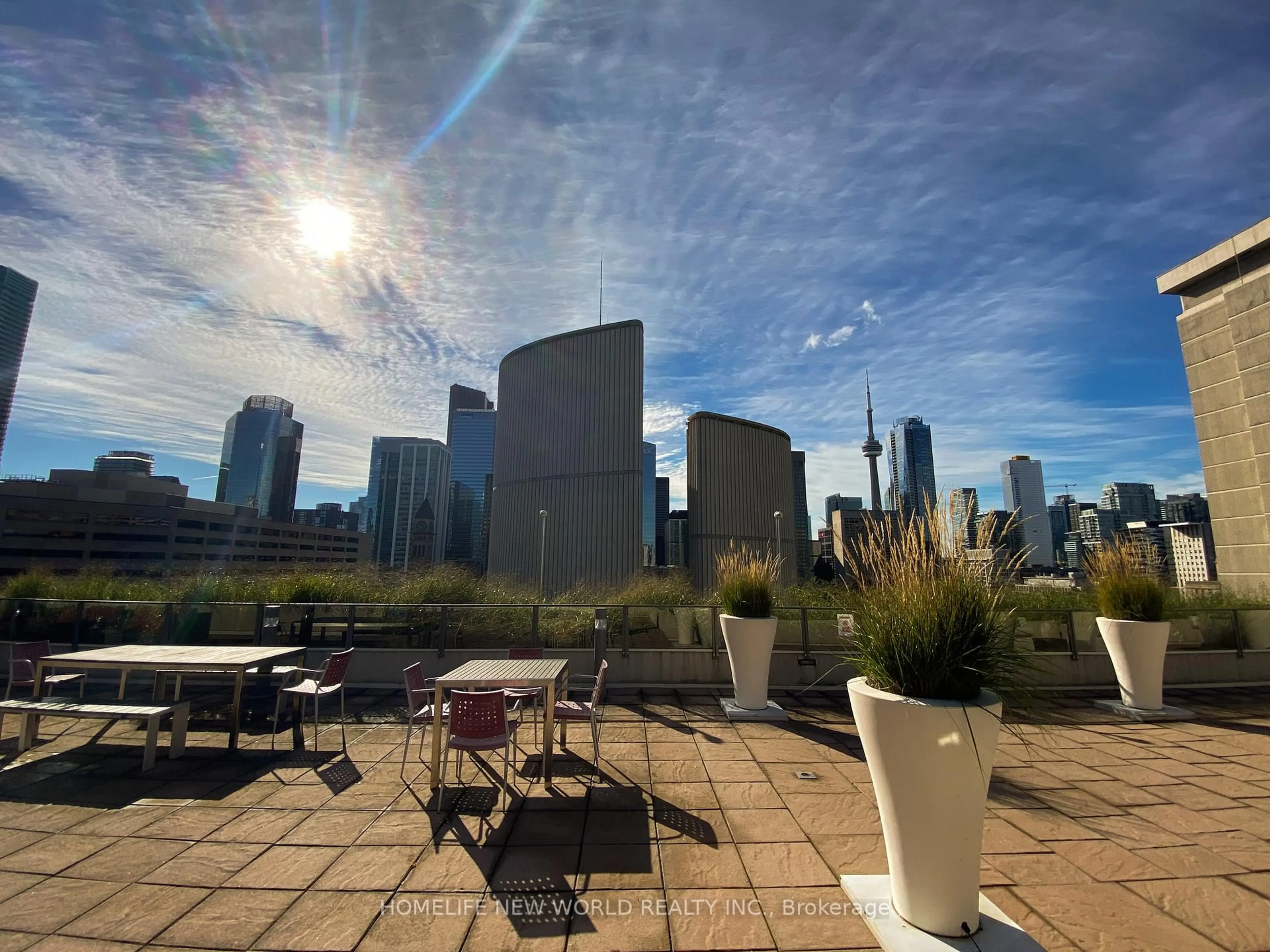 Patio, city buildings view from balcony for 111 Elizabeth St #515, Toronto Ontario M5G 1P7