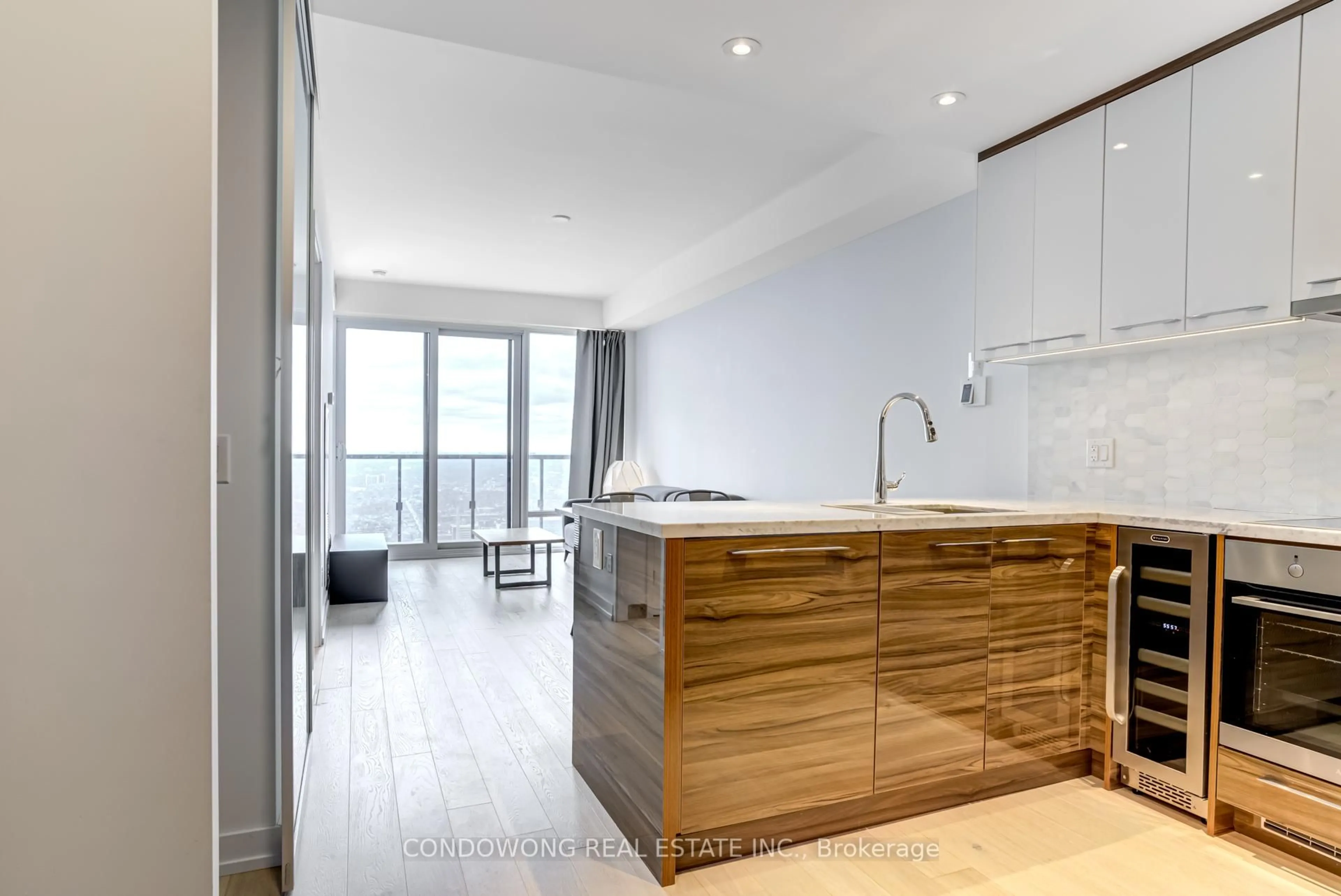 Open concept kitchen, wood/laminate floor for 488 University Ave #4811, Toronto Ontario M5G 0C1