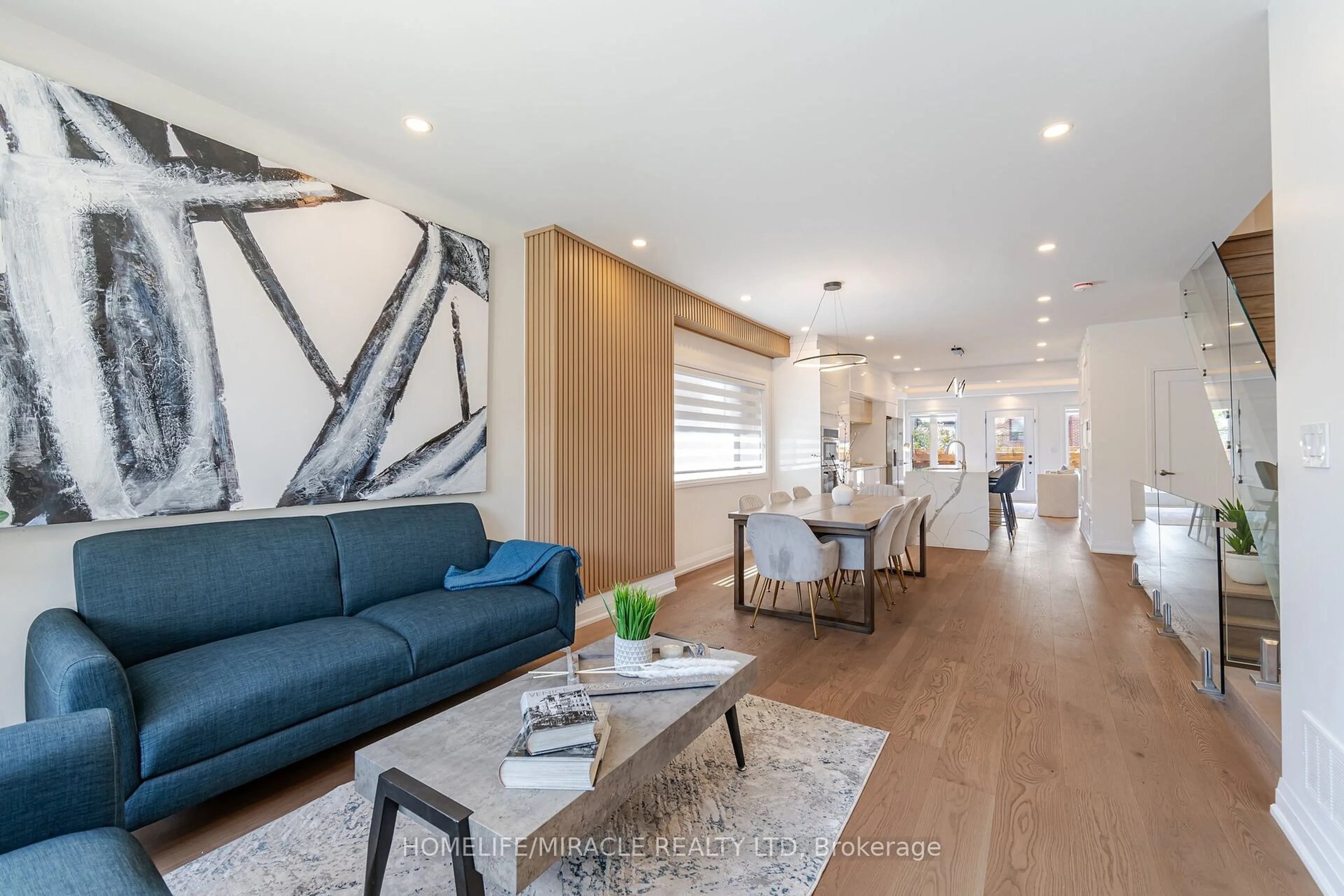 Living room with furniture, wood/laminate floor for 388 Oakwood Ave, Toronto Ontario M6E 2W3