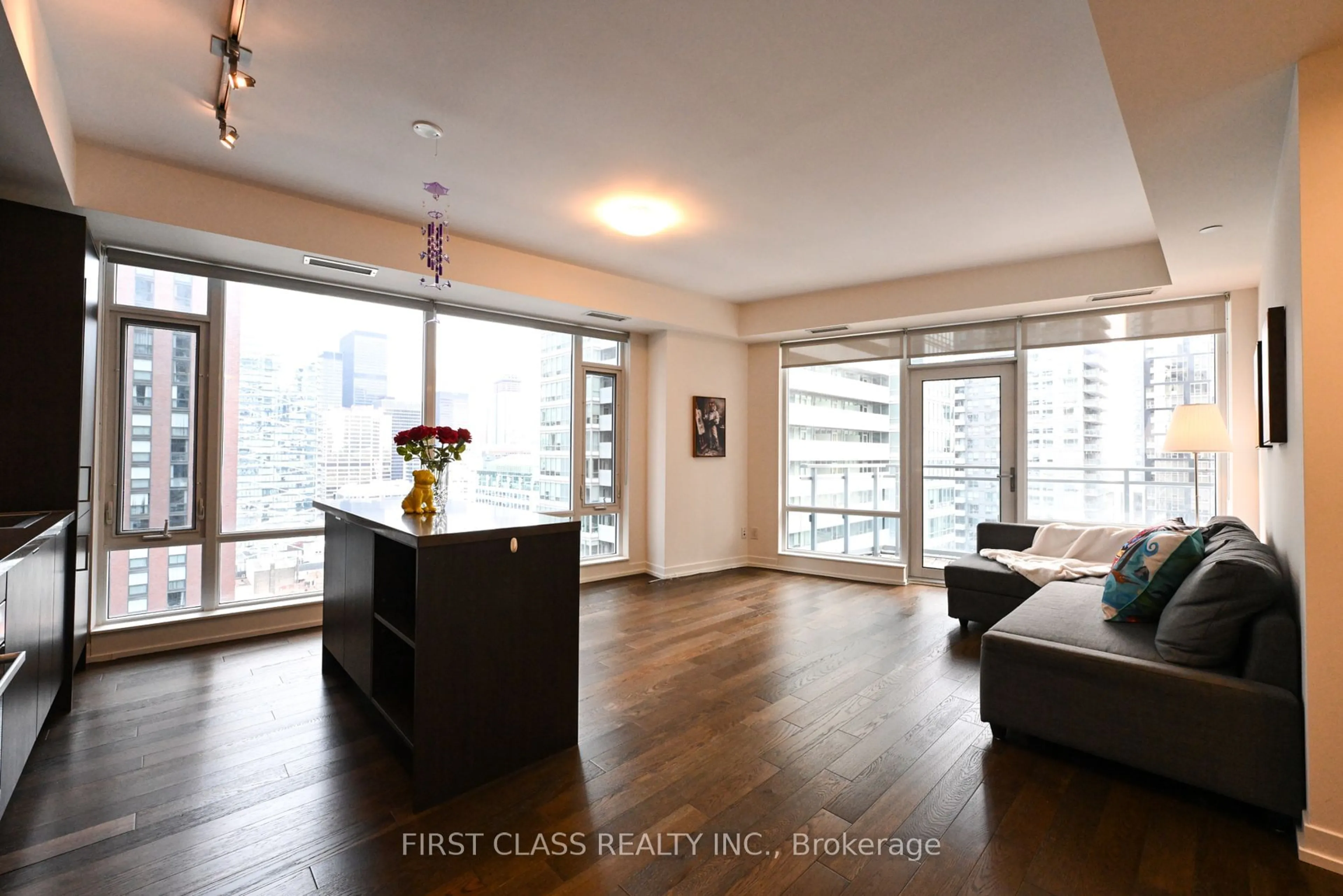 Living room with furniture, wood/laminate floor for 21 Widmer St, Toronto Ontario M5V 2E8