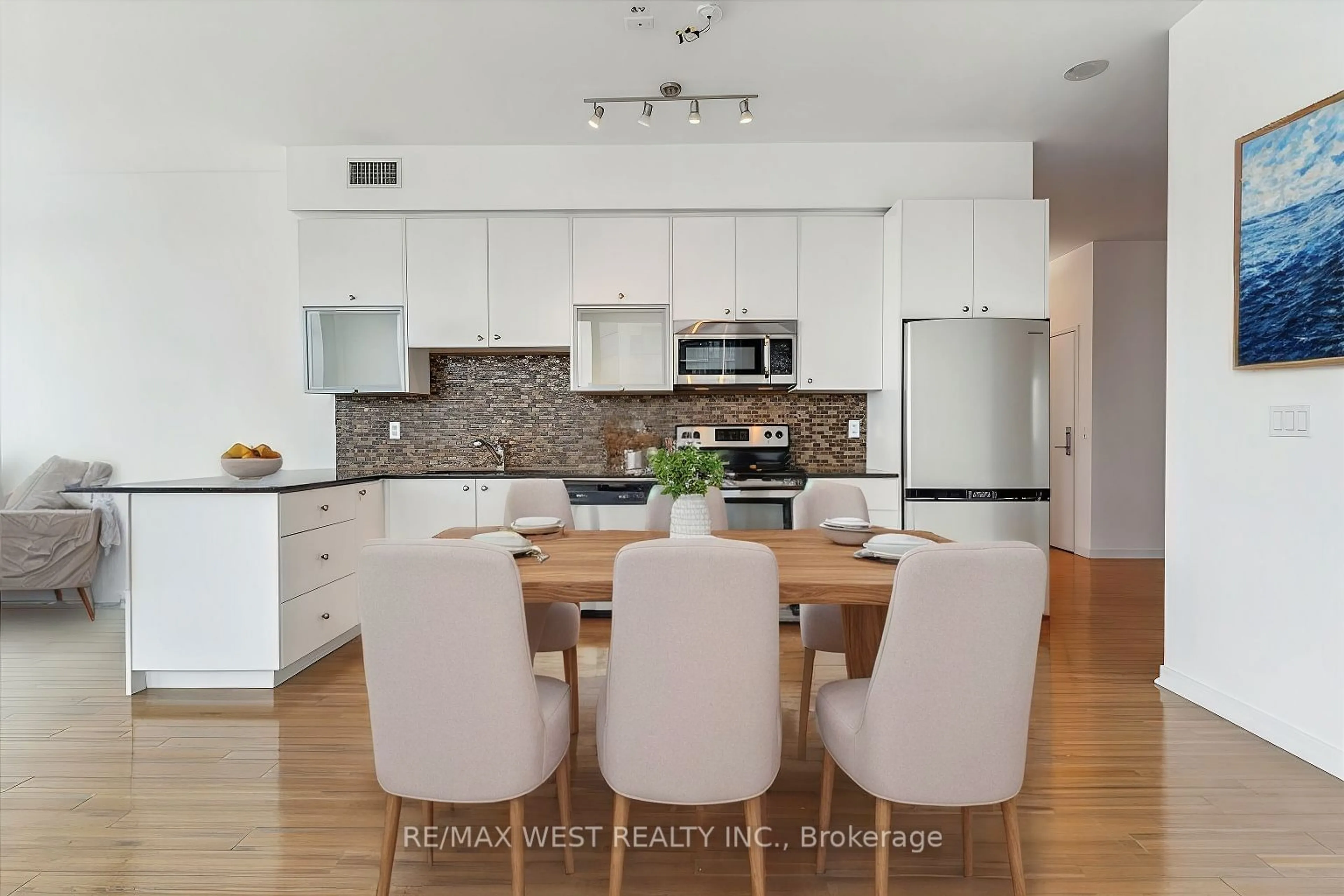 Open concept kitchen, wood/laminate floor for 59 East LIberty St #2302, Toronto Ontario M6K 3R1