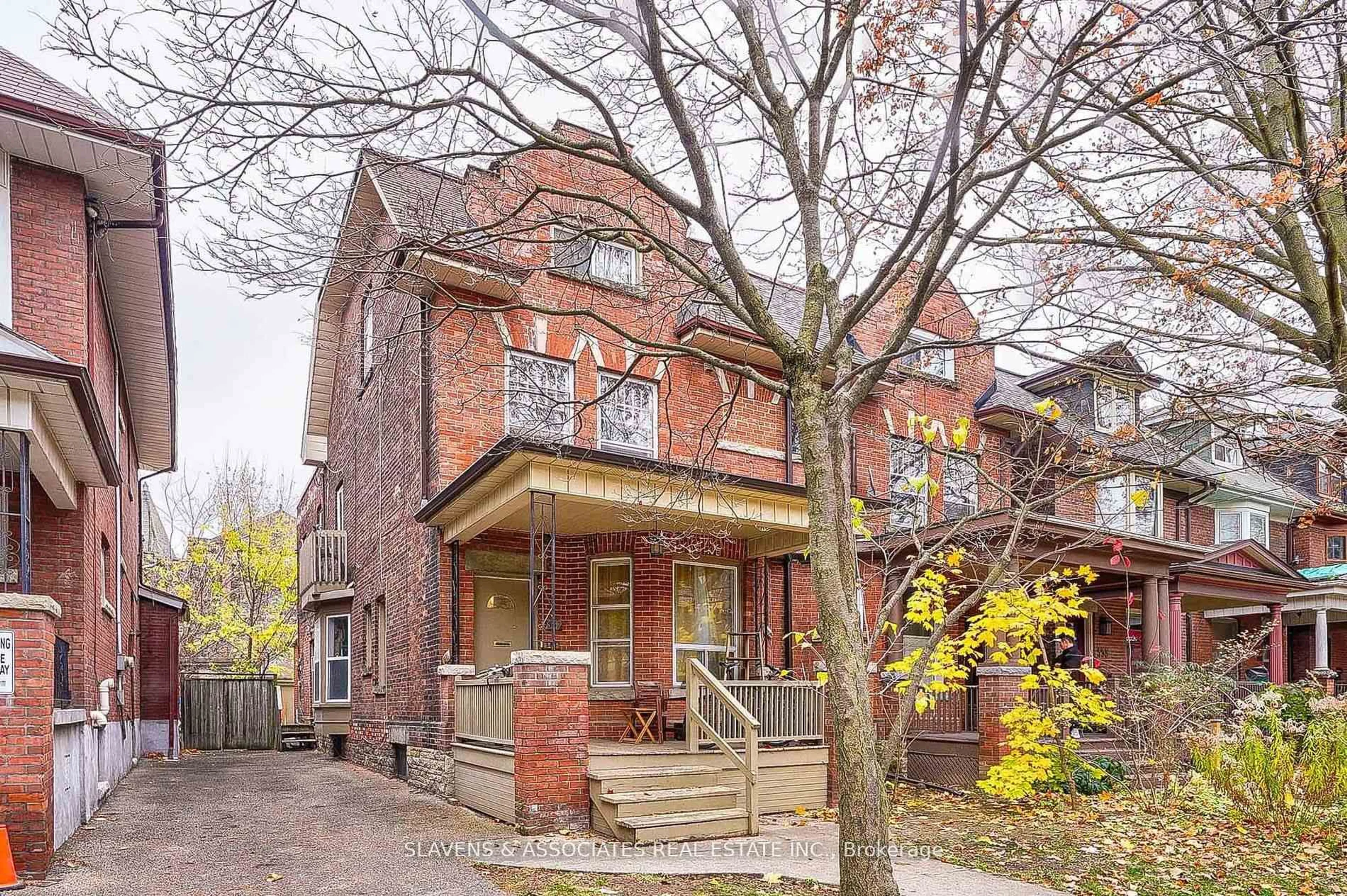 Home with brick exterior material, street for 557 Markham St, Toronto Ontario M6G 2L6