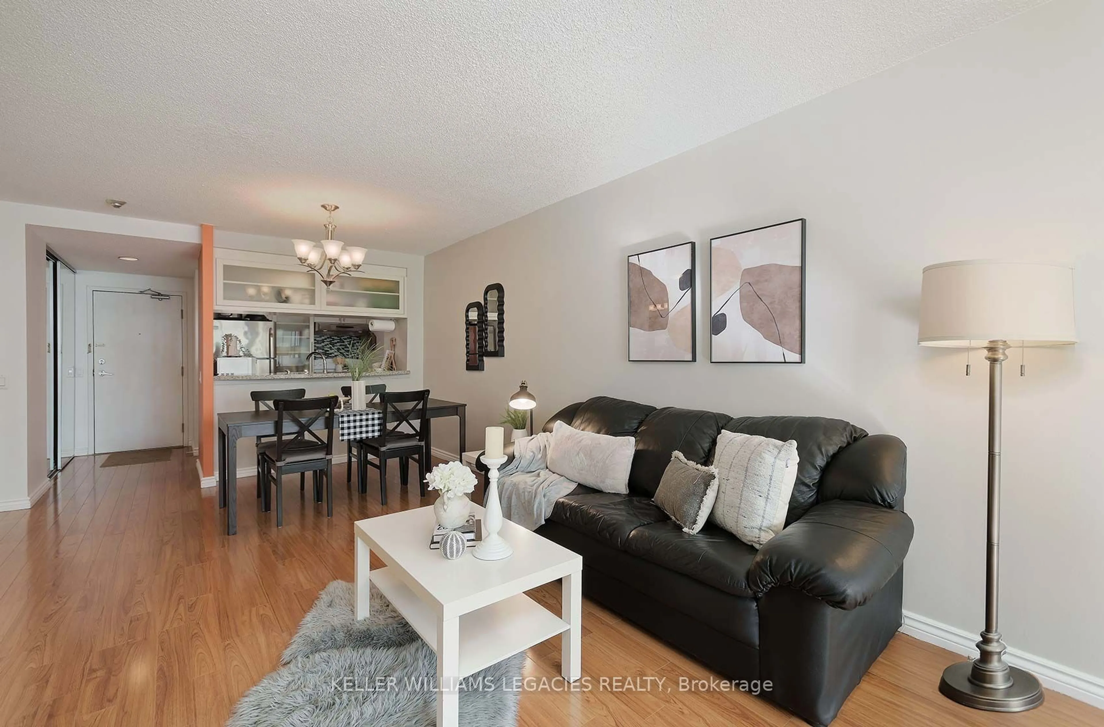 Living room with furniture, wood/laminate floor for 7 Bishop Ave #1203, Toronto Ontario M2M 4J4