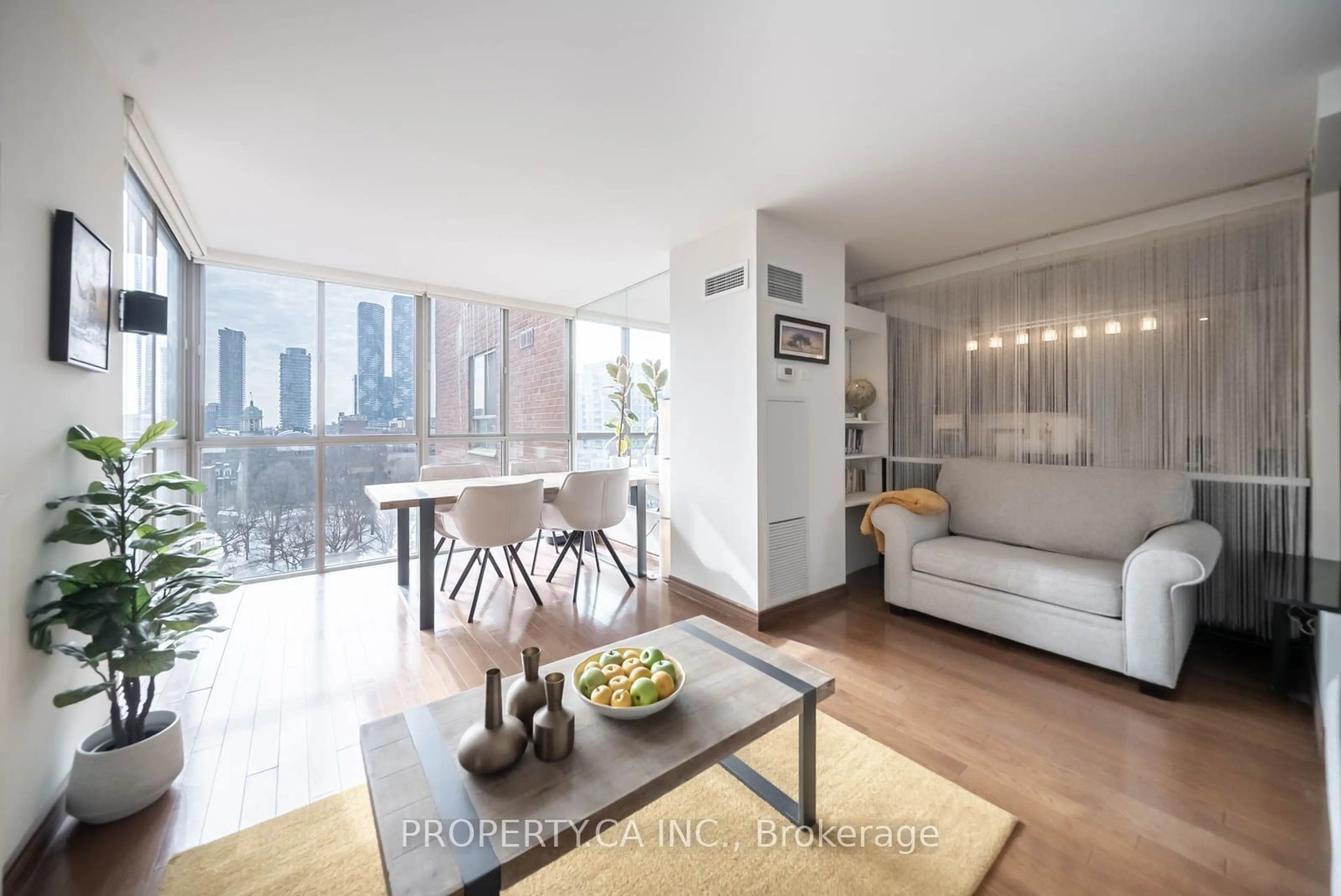 Living room with furniture, wood/laminate floor for 95 Lombard St #801, Toronto Ontario M5C 2V3