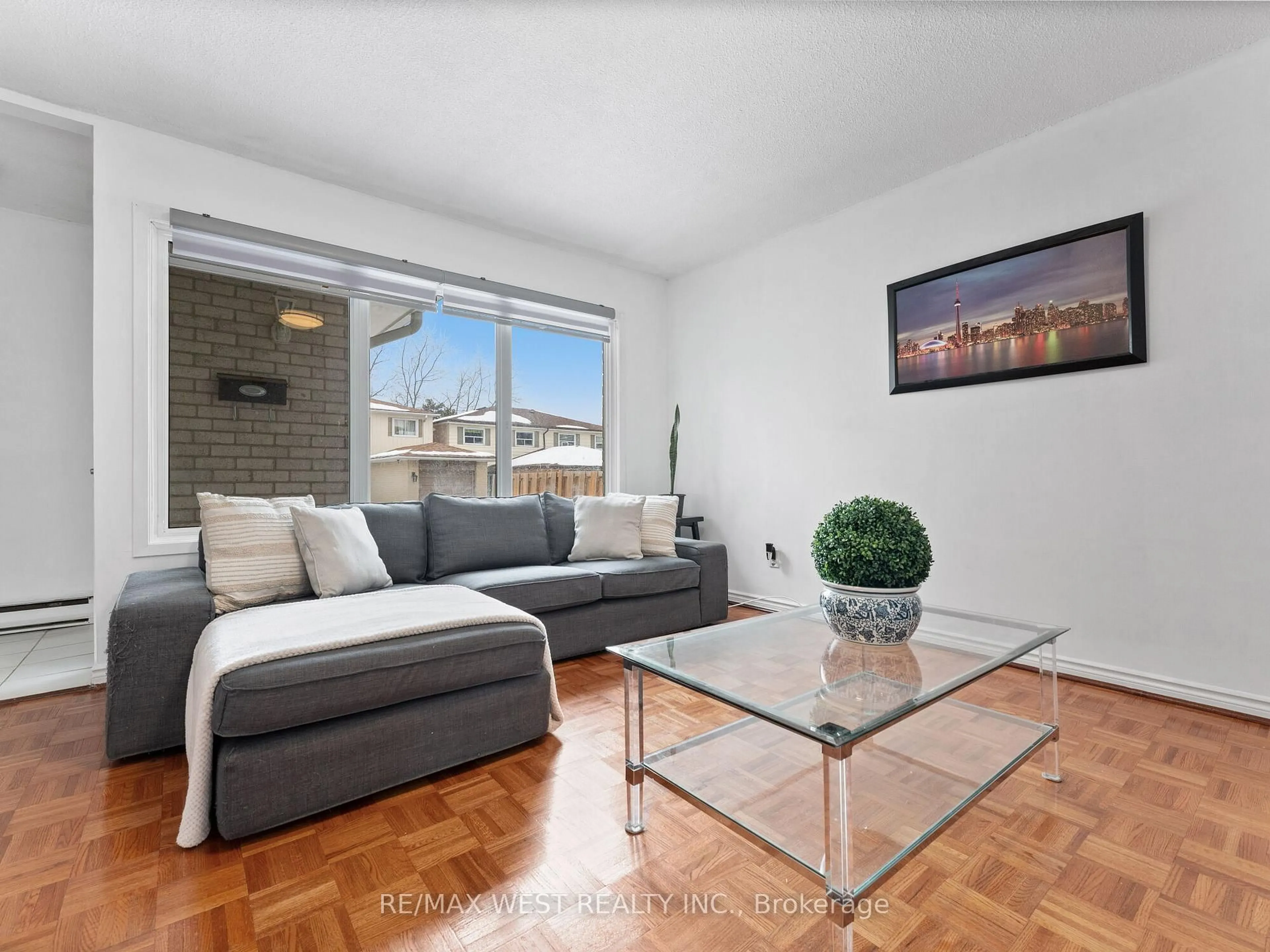 Living room with furniture, wood/laminate floor for 94 Plum Tree Way, Toronto Ontario M2R 3J1