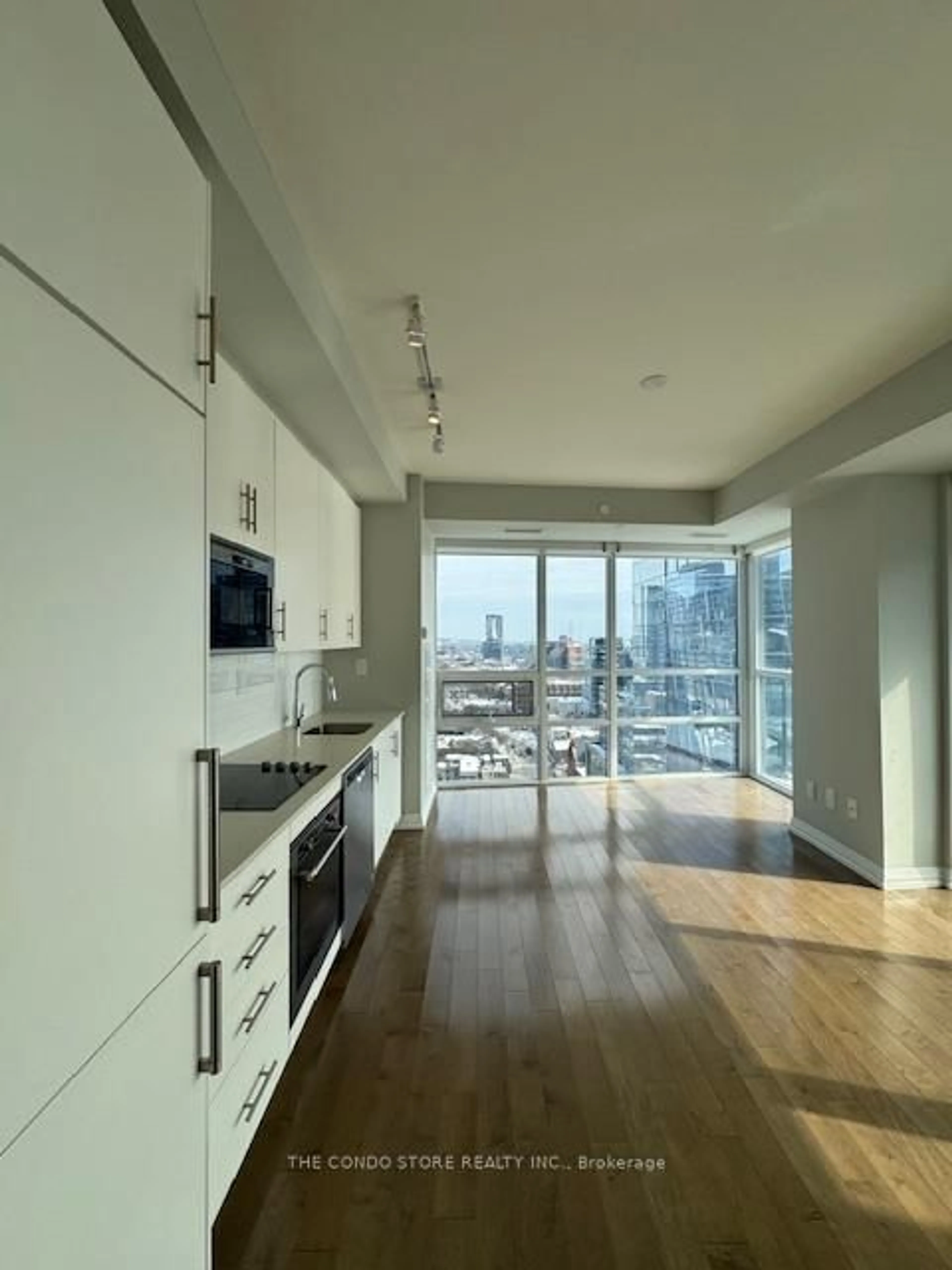 Open concept kitchen, wood/laminate floor for 460 Adelaide St #1911, Toronto Ontario M5A 0E7