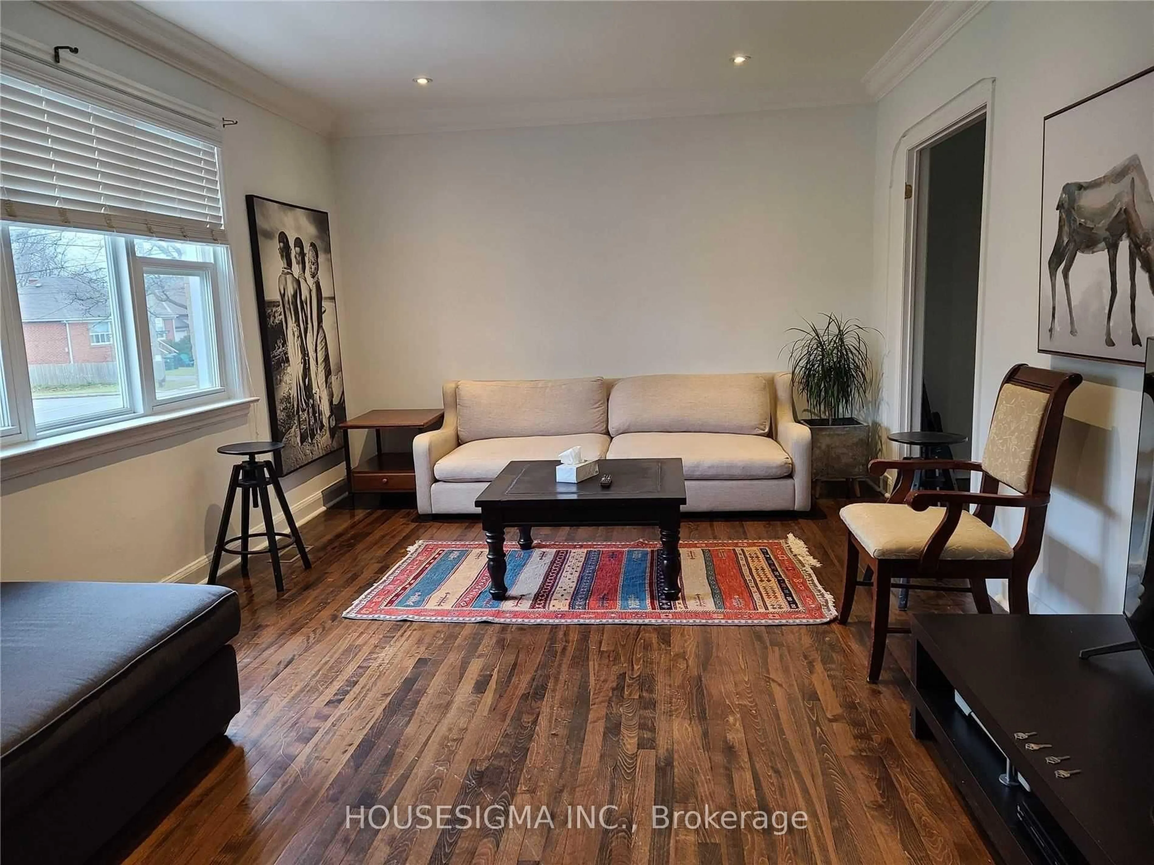 Living room with furniture, wood/laminate floor for 94 Fairholme Ave, Toronto Ontario M6B 2W6