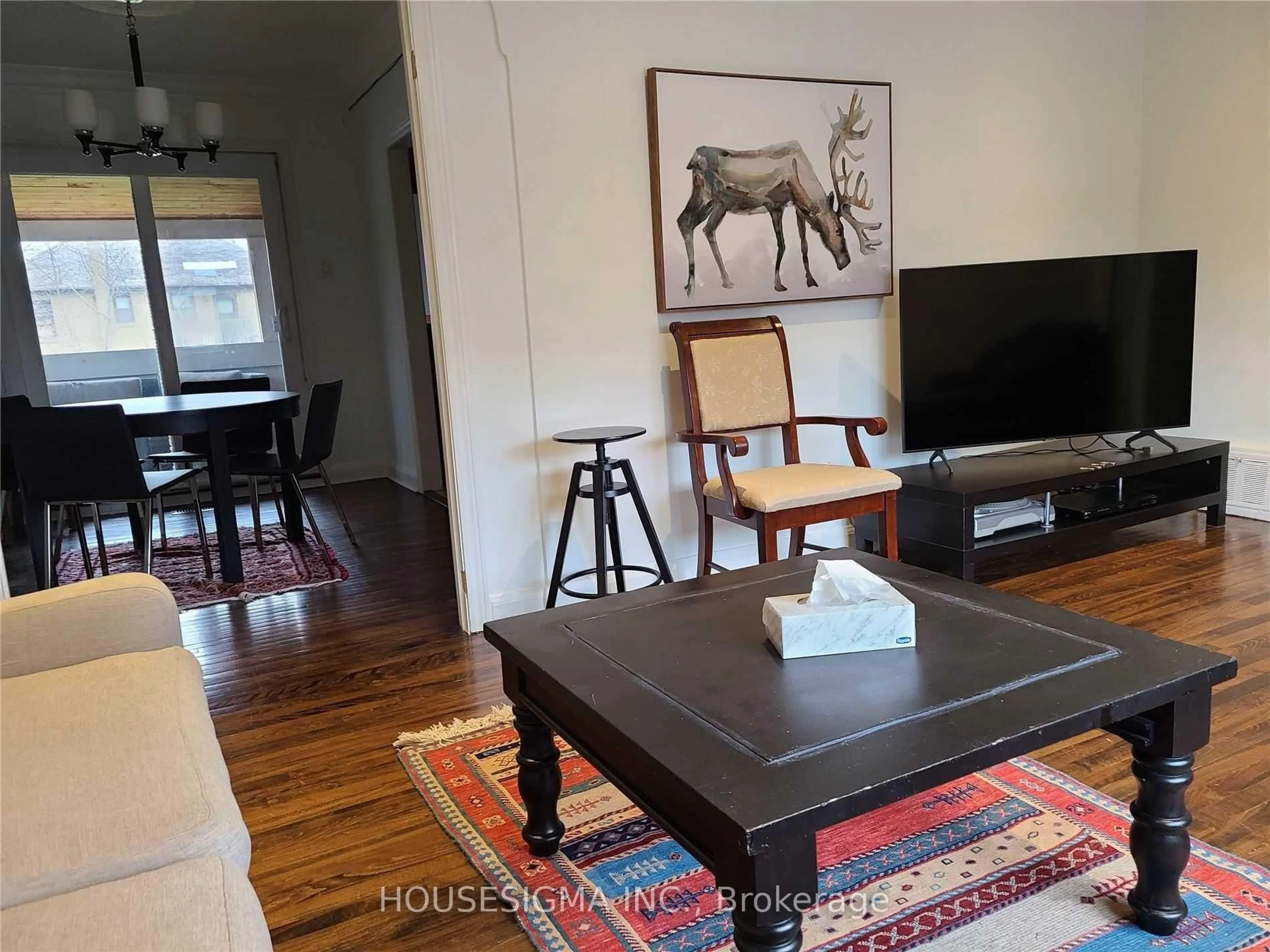 Living room with furniture, wood/laminate floor for 94 Fairholme Ave, Toronto Ontario M6B 2W6