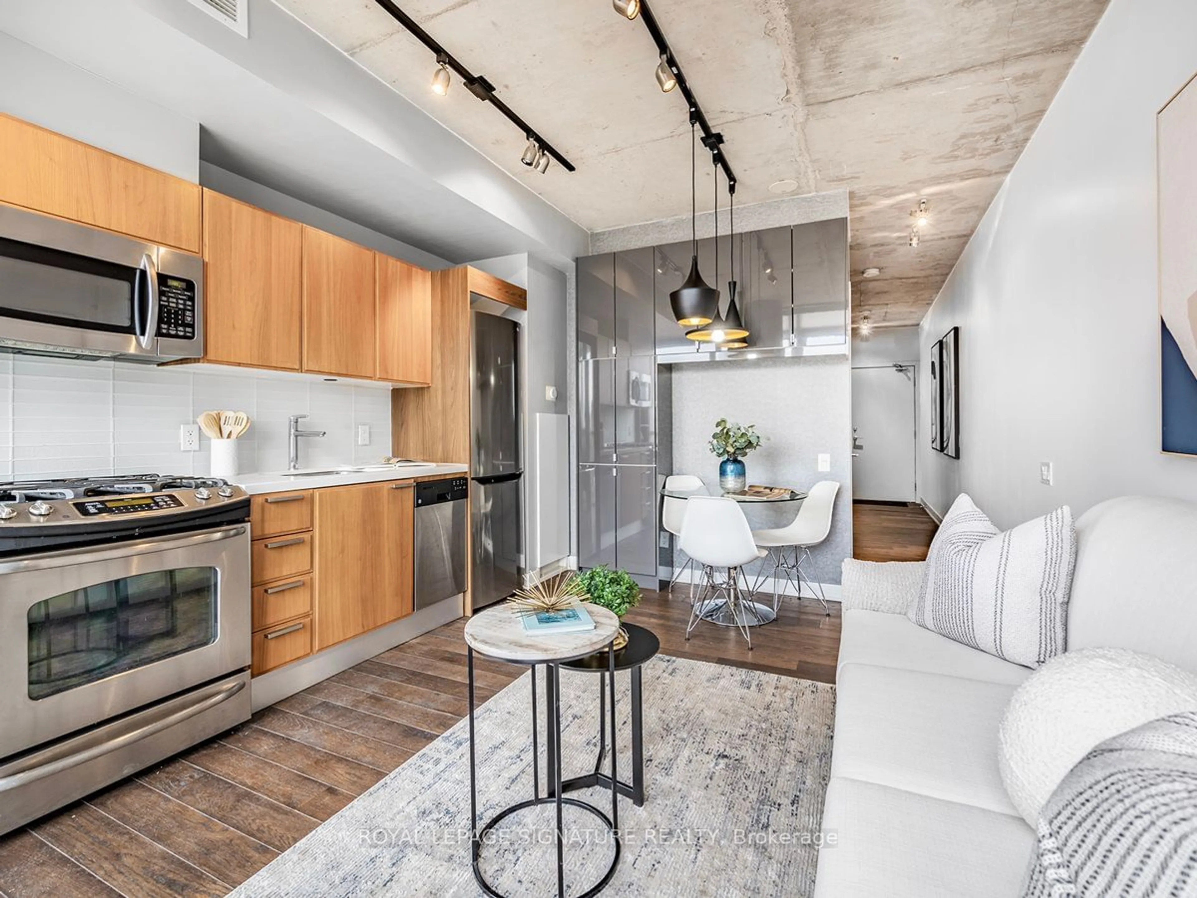 Open concept kitchen, cement floor for 318 King St #513, Toronto Ontario M5A 0C1