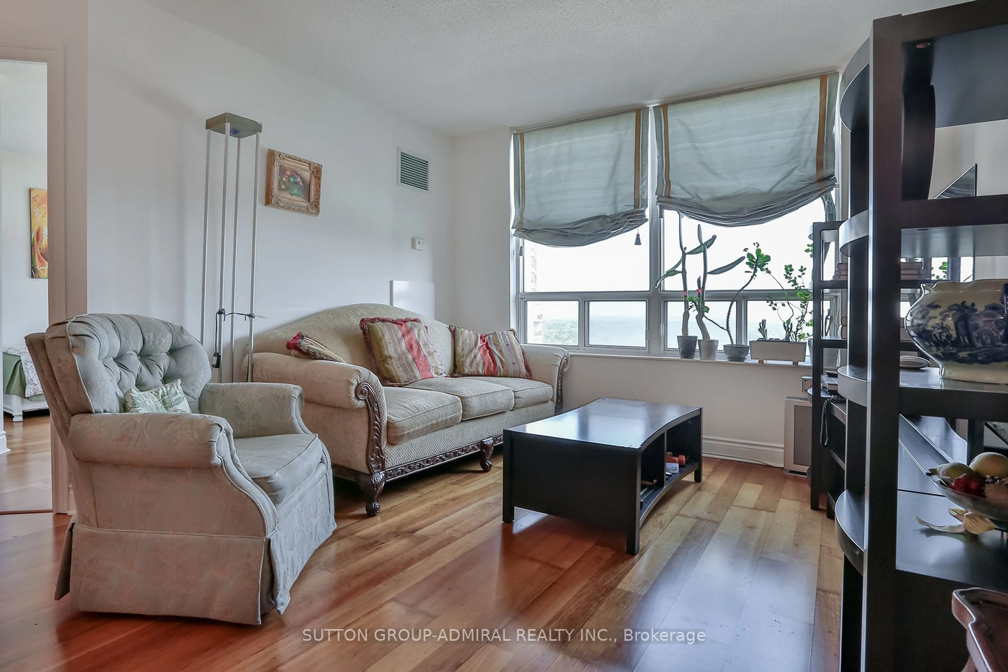 Living room with furniture, wood/laminate floor for 78 Harrison Garden Blvd #1403, Toronto Ontario M2N 7E2