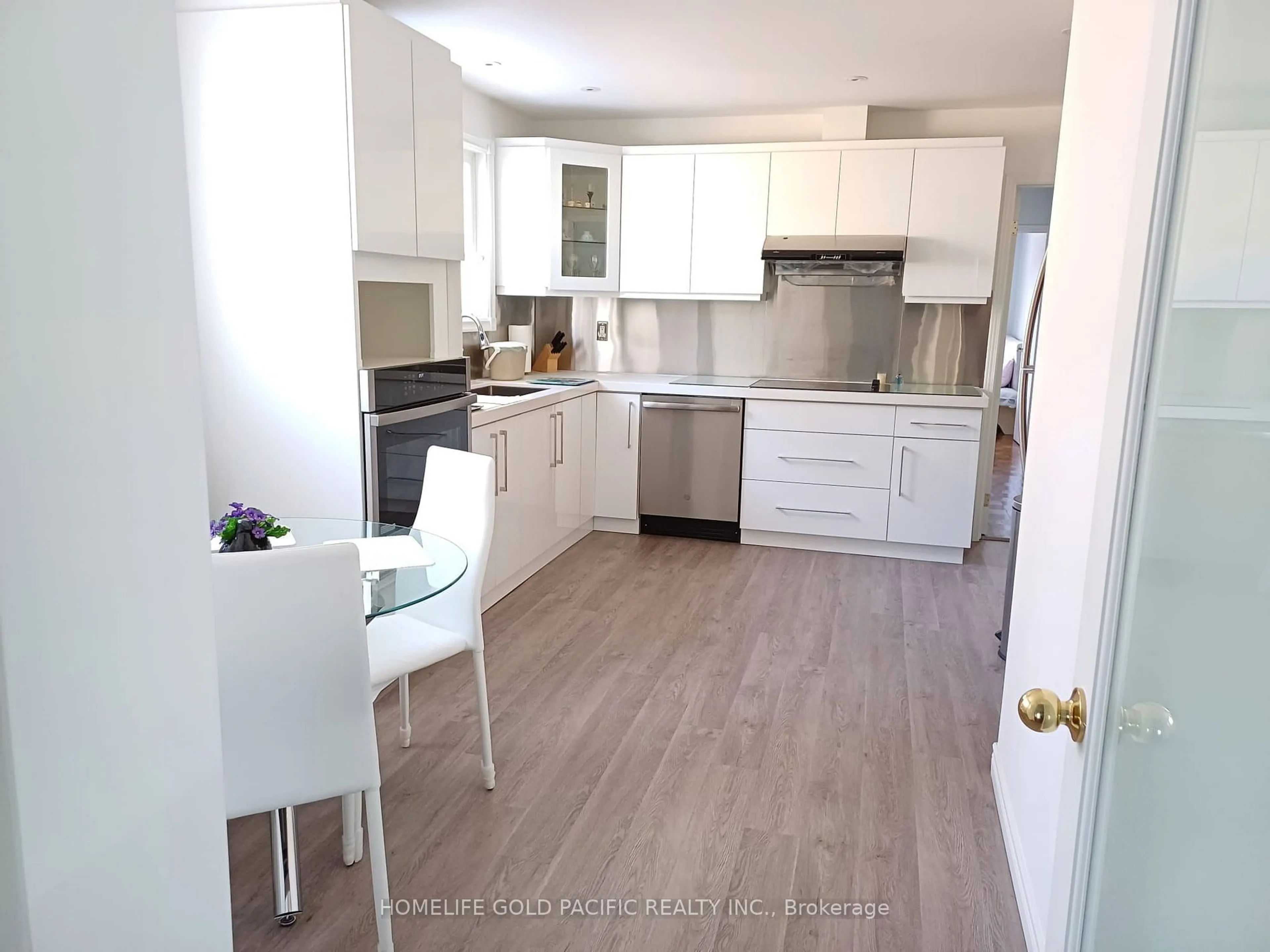 Open concept kitchen, wood/laminate floor for 49 Mentor Blvd, Toronto Ontario M2H 2M9