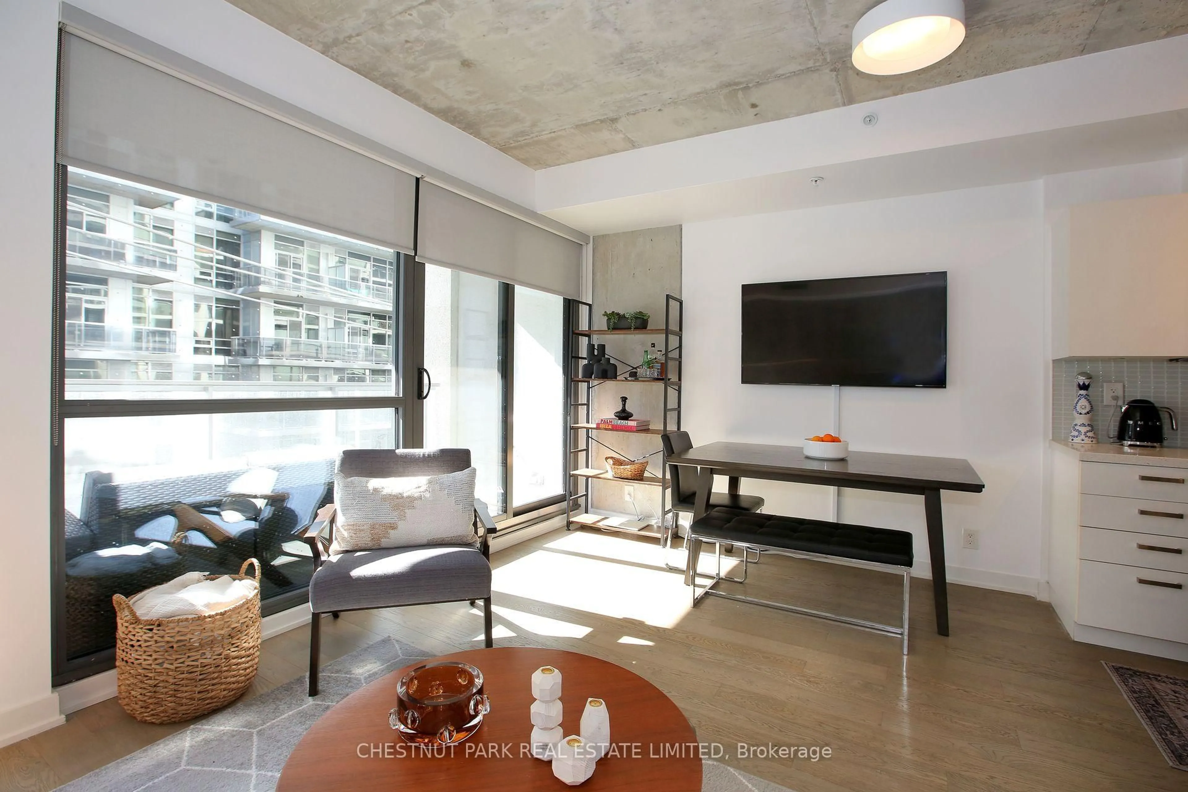 Living room with furniture, cement floor for 39 Brant St #310, Toronto Ontario M5V 2L9