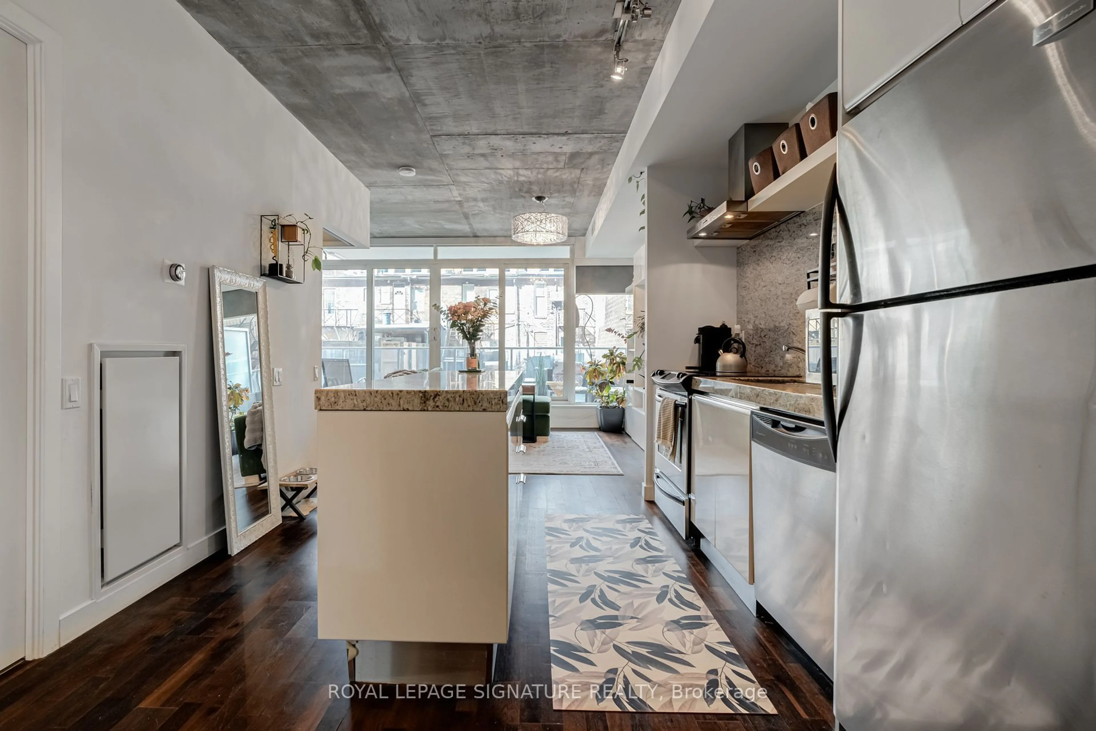 Open concept kitchen, cement floor for 75 Portland St #312, Toronto Ontario M5V 2M9