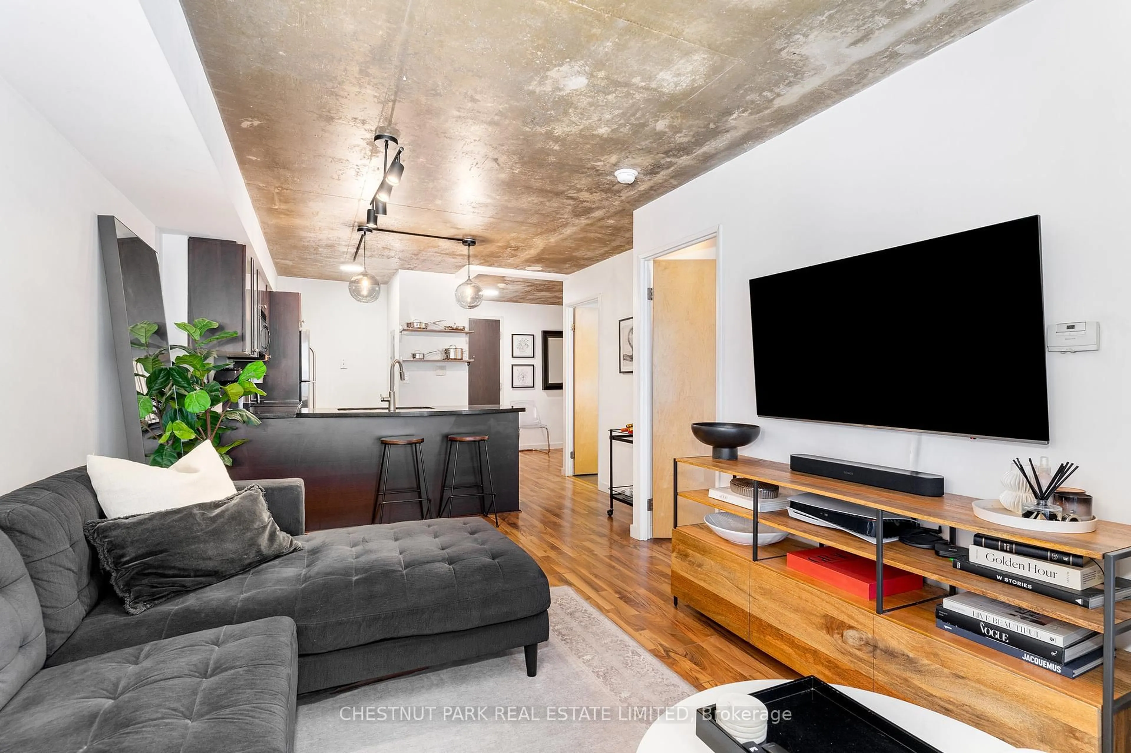 Living room with furniture, cement floor for 1005 King St #404, Toronto Ontario M6K 3M8