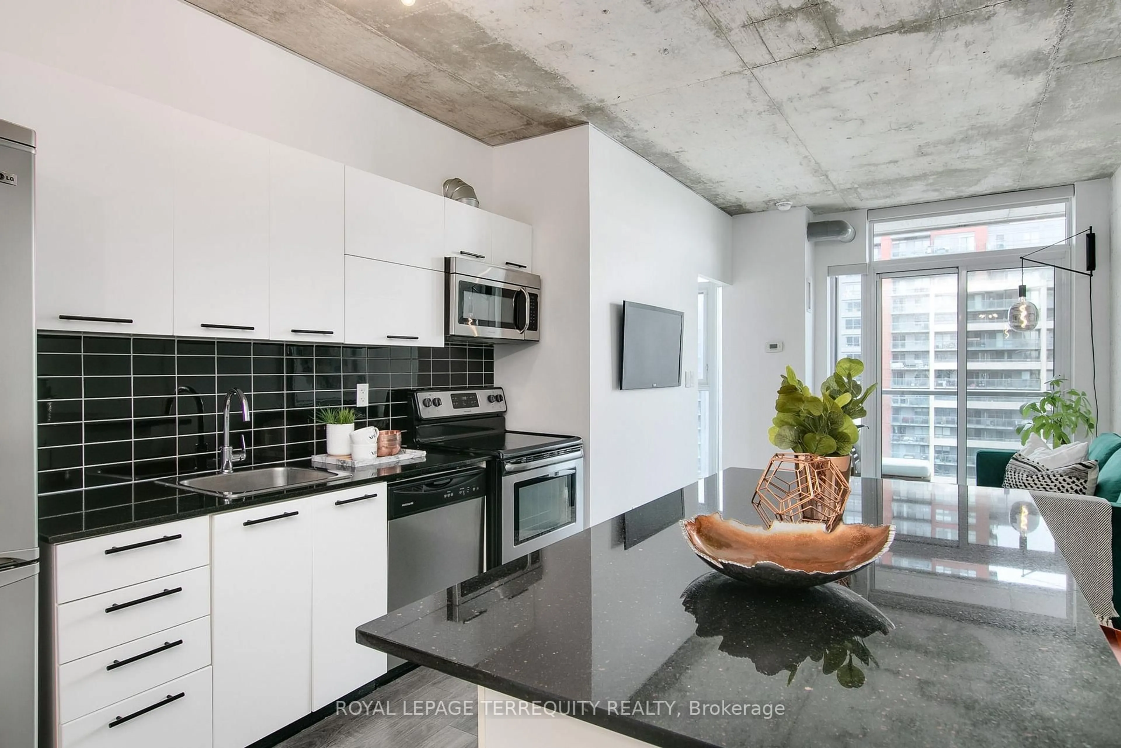 Open concept kitchen, cement floor for 150 Sudbury St #1014, Toronto Ontario M6J 3S8