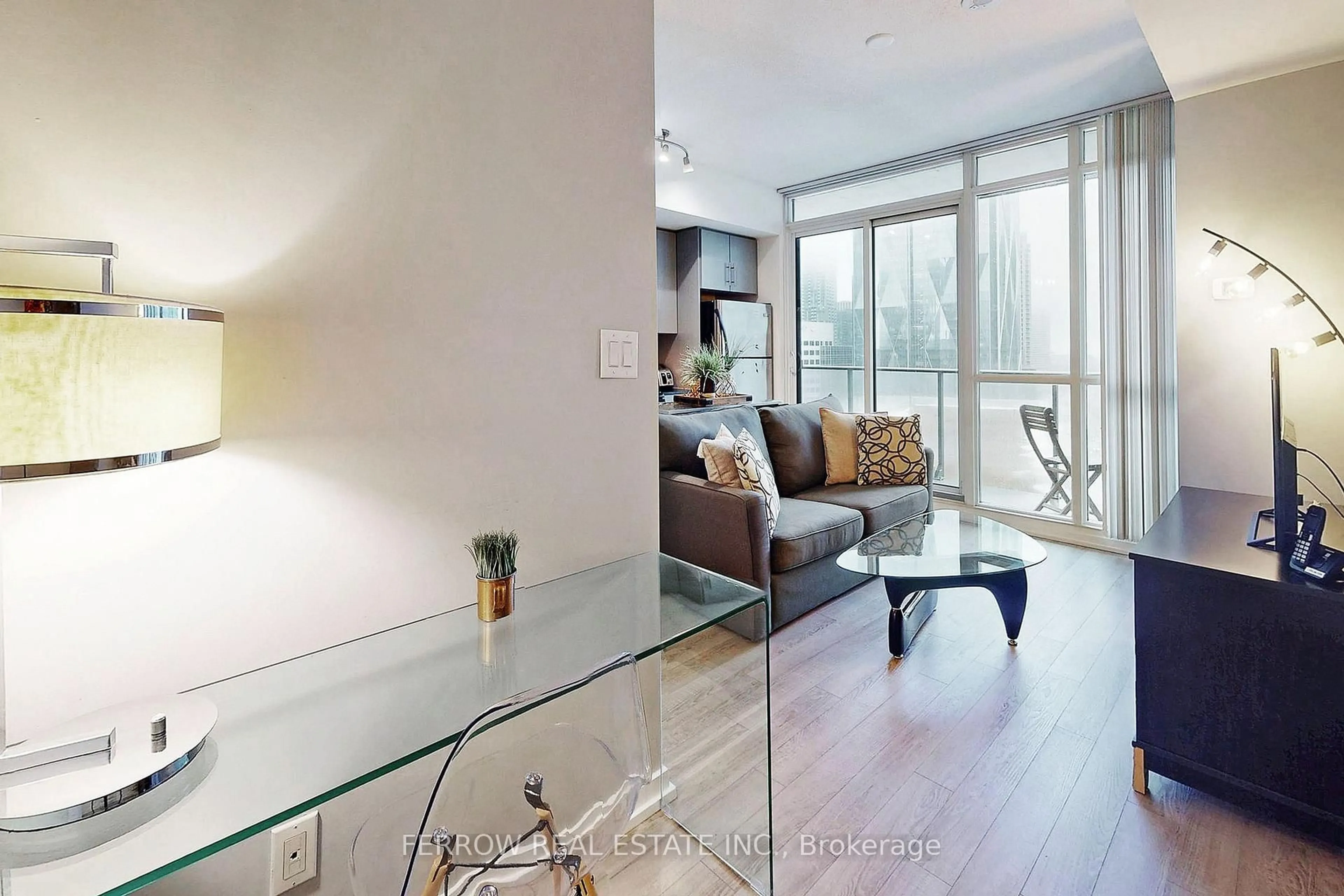 Living room with furniture, wood/laminate floor for 55 Bremner Blvd #1306, Toronto Ontario M5J 0A6